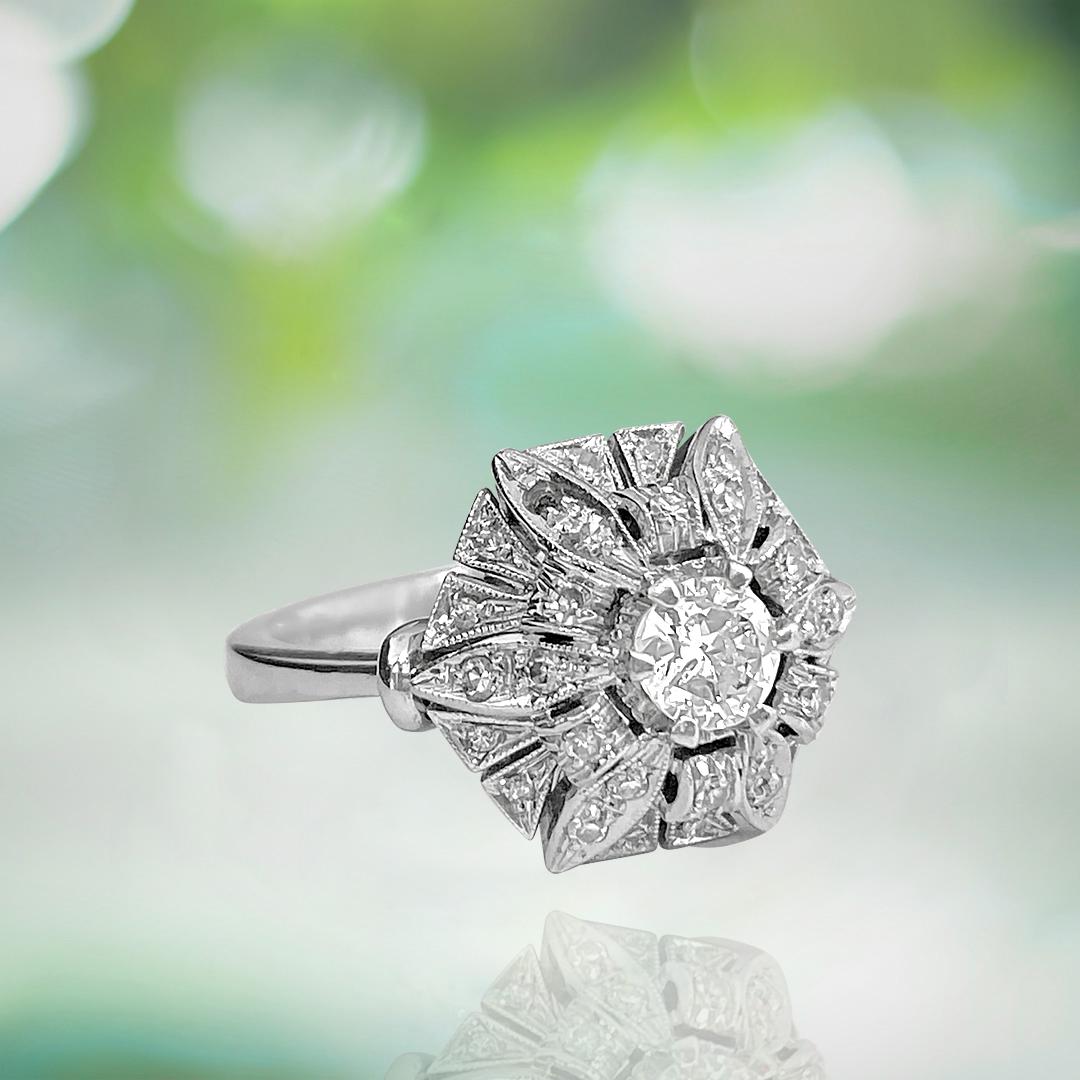 Metal: 18K white gold. 
0.55 carat center diamond, round brilliant cut, set in prongs. 

Side Diamonds: 1.50 carats total. Single cut.  VS clarity and G color. 
All diamonds are 100% natural earth mined and genuine. 

Certified by GIA graduate