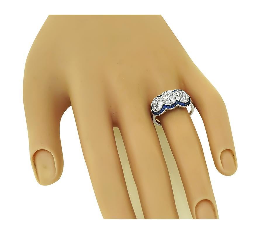 This is a fabulous platinum anniversary ring from the Art Deco era. The ring is set with three sparkling GIA certified old European cut diamonds that weigh 1.08ct, 1.01ct and 1.01ct. The color of these diamonds is I with VS1 clarity, H with SI1