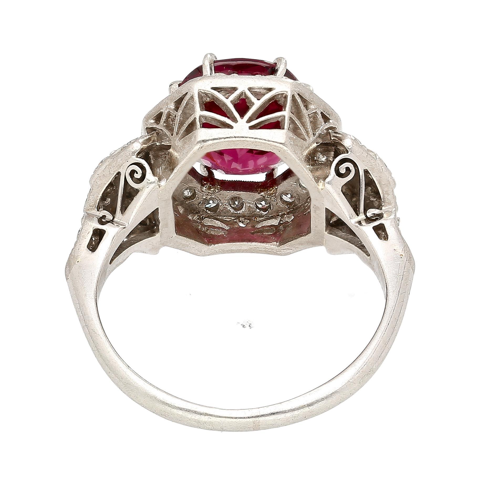 Vintage Art Deco GIA Certified No Heat Spinel 18K Gold and Platinum Ring. 

This cathedral ring features a natural red spinel center gemstone. The spinel carries a carat weight of 4.35 and holds a red hue. There is no evidence of heat treatment on