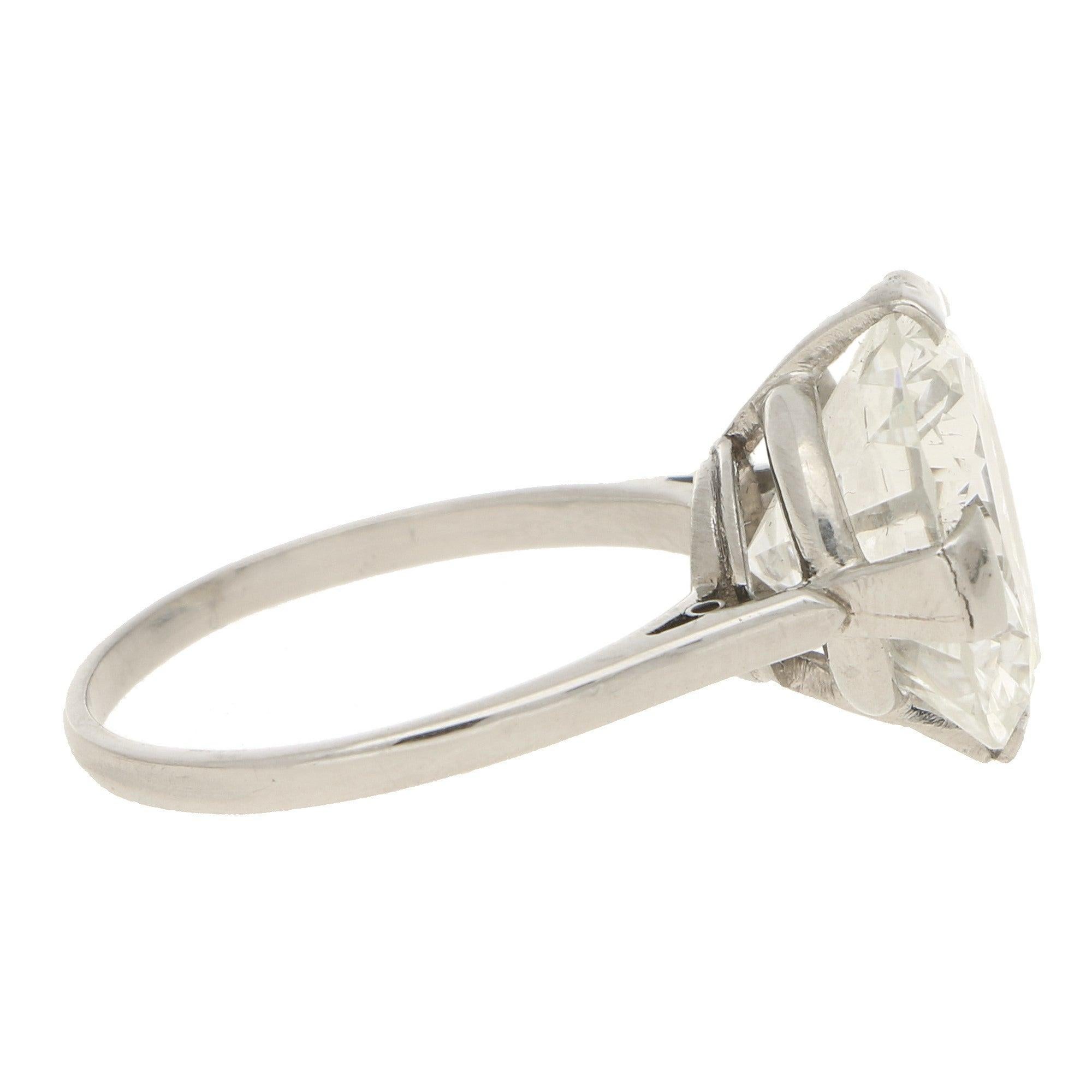 A truly remarkable Art Deco diamond single solitaire ring set in platinum.

The ring is solely set with a magnificent 7.49 carat round brilliant cut diamond. This is four claw-set in a white gold open gallery setting which flows nicely to slightly