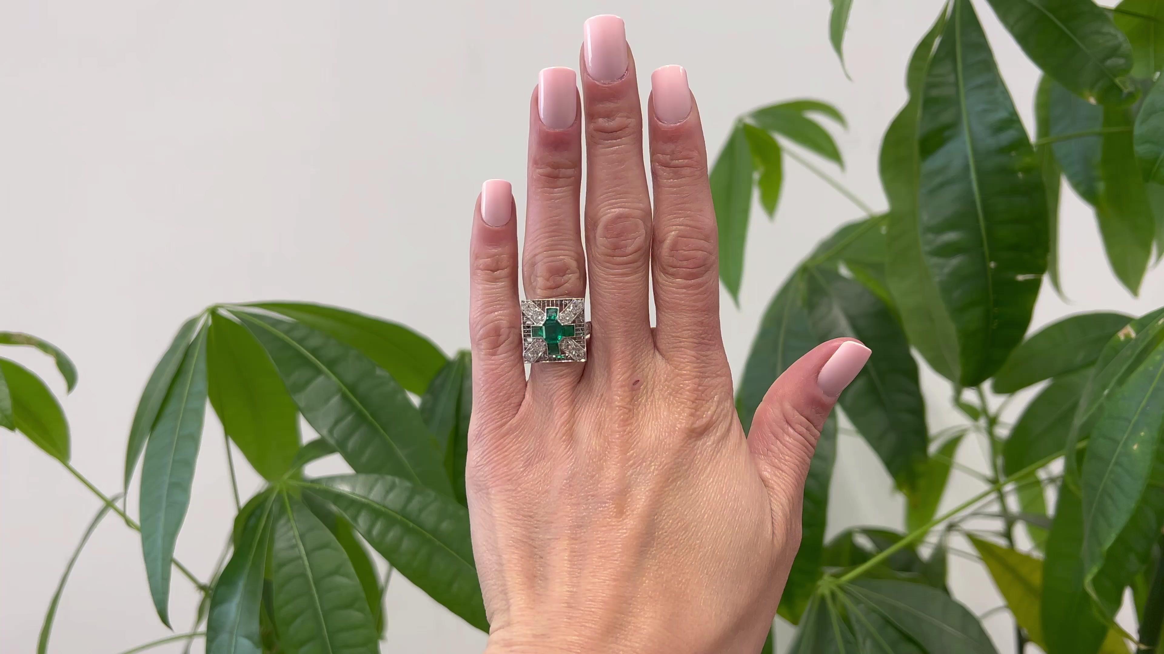 One Art Deco GIA Colombian Emerald and Diamond Platinum Square Dinner Ring. Featuring one GIA octagonal step cut emerald weighing approximately 0.85 carat, accompanied with GIA #6223980679 stating the emerald is of Colombian origin. Accented by four