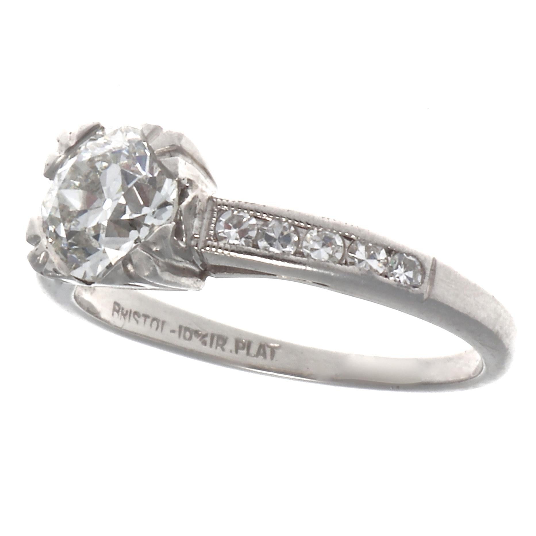 Authentic Art Deco diamond platinum ring. Featuring a GIA 0.78 carat old European cut diamond, graded I color, VS1 clarity. With 10 single cut diamonds that weigh approximately 0.25 carats, graded F-G color, VS clarity. Circa 1920s. Size 4 3/4 and