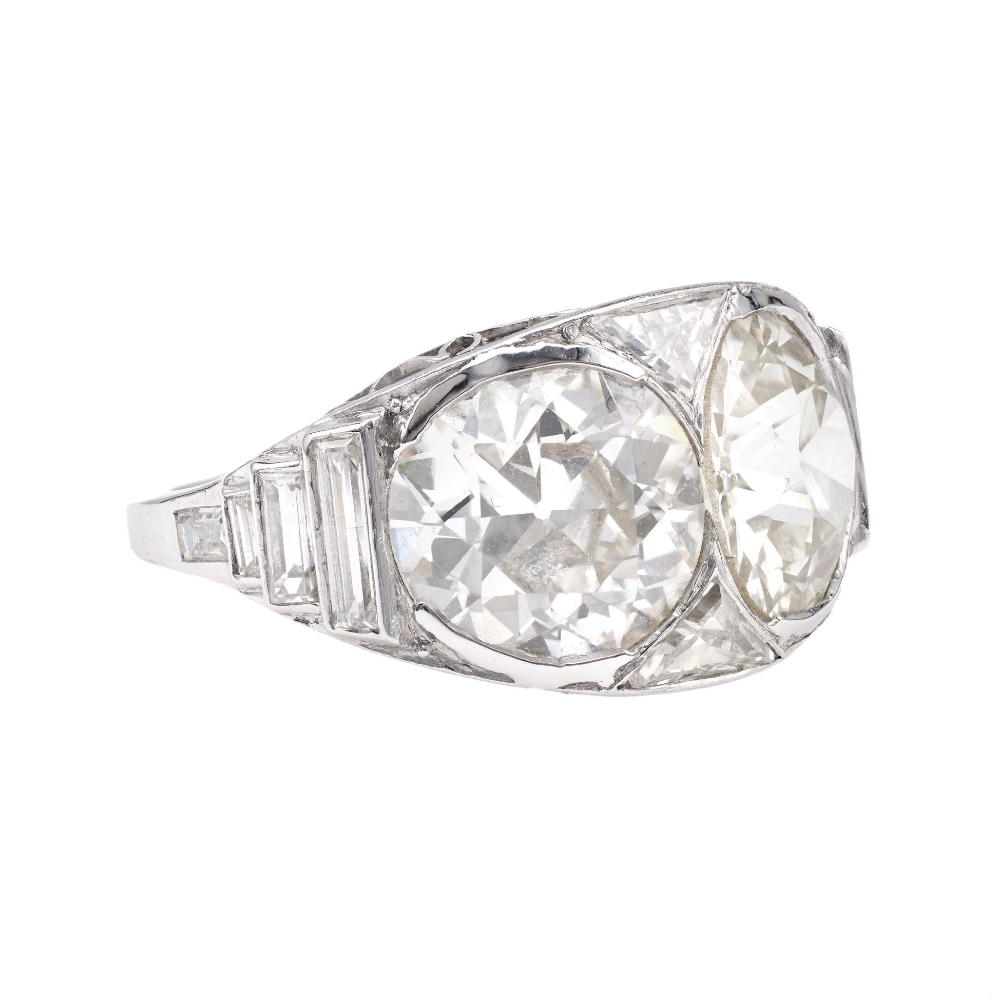 One Art Deco GIA Diamond Platinum Toi et Moi Ring. Featuring one old European cut diamond of 2.70 carats, accompanied by GIA #2231159303 stating the diamond is N color, VS1 clarity, and one old European cut diamond of 2.57 carats, accompanied by GIA