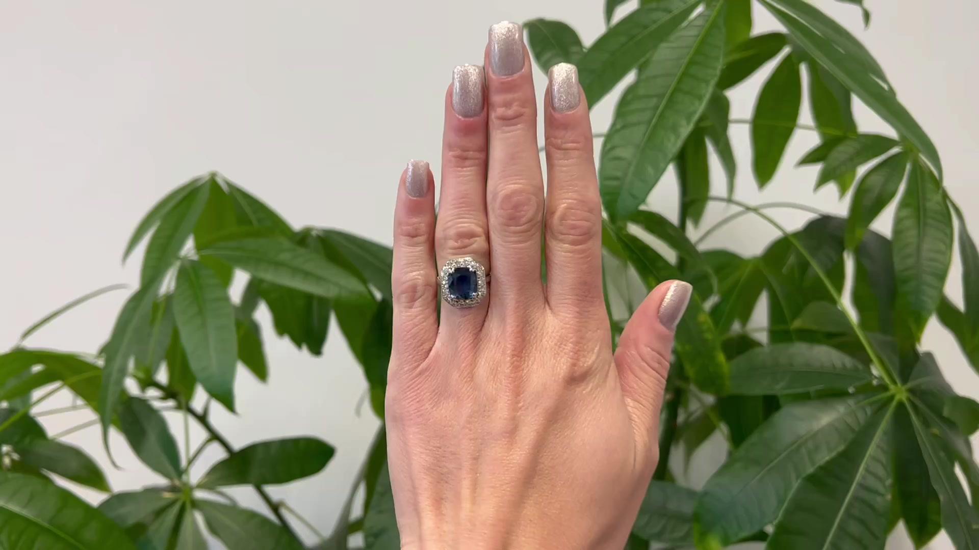 One Art Deco GIA Thai Sapphire and Diamond Platinum Ring. Featuring one GIA oval mixed cut sapphire weighing approximately 3.85 carats, accompanied with GIA #5221947026 stating the sapphire is of Thai origin. Accented by 18 single cut diamonds with