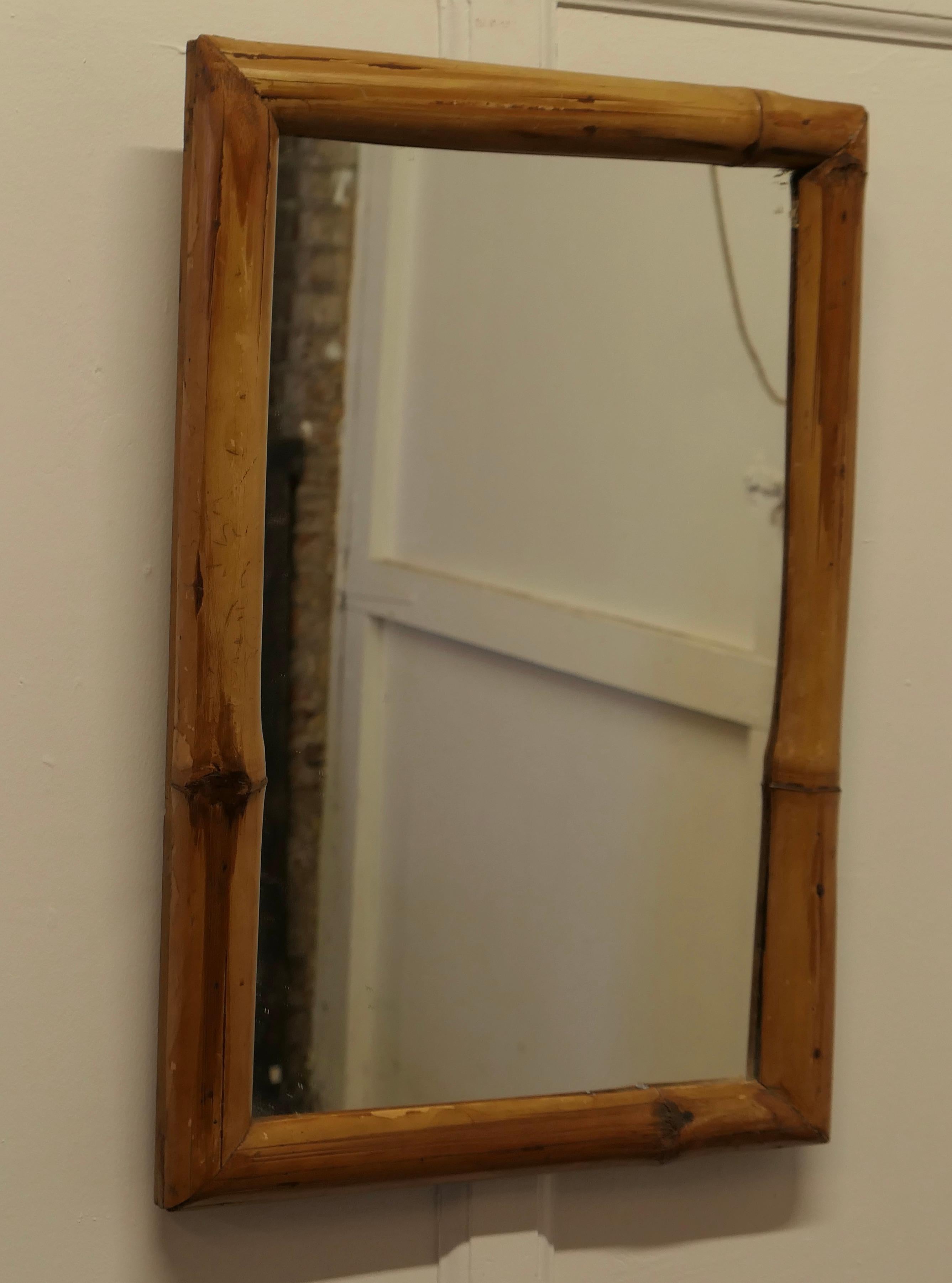 Art Deco Giant Bamboo Wall Mirror

This is a very attractive piece, the tall mirror is framed with a giant 2” wide bamboo frame 
The mirror is 28” high and 29” wide 
MS165.