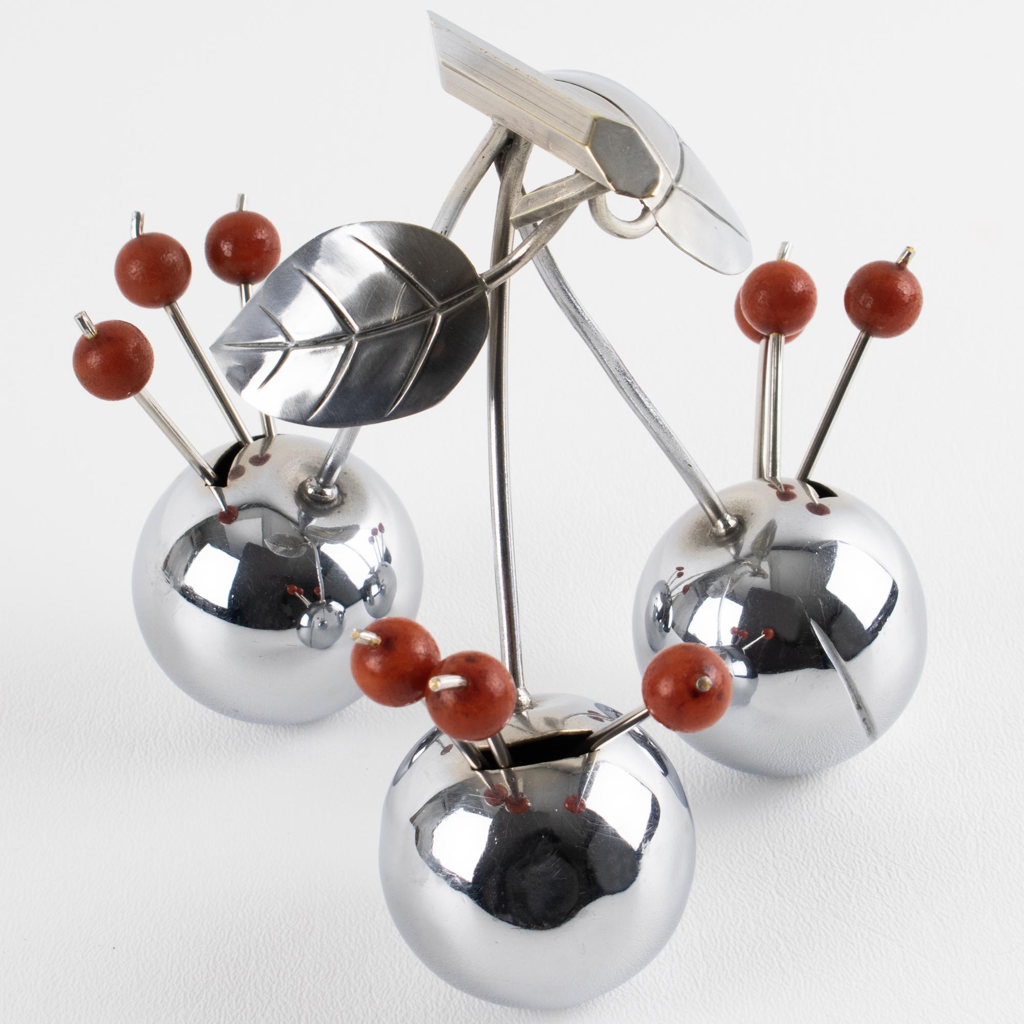 This stunning Art Deco barware cocktail picks was designed by renowned silversmith Gouaille, Paris. The piece was expertly crafted in France circa 1930. This rare bar set is made of polished chromed metal and features three giant cherries with