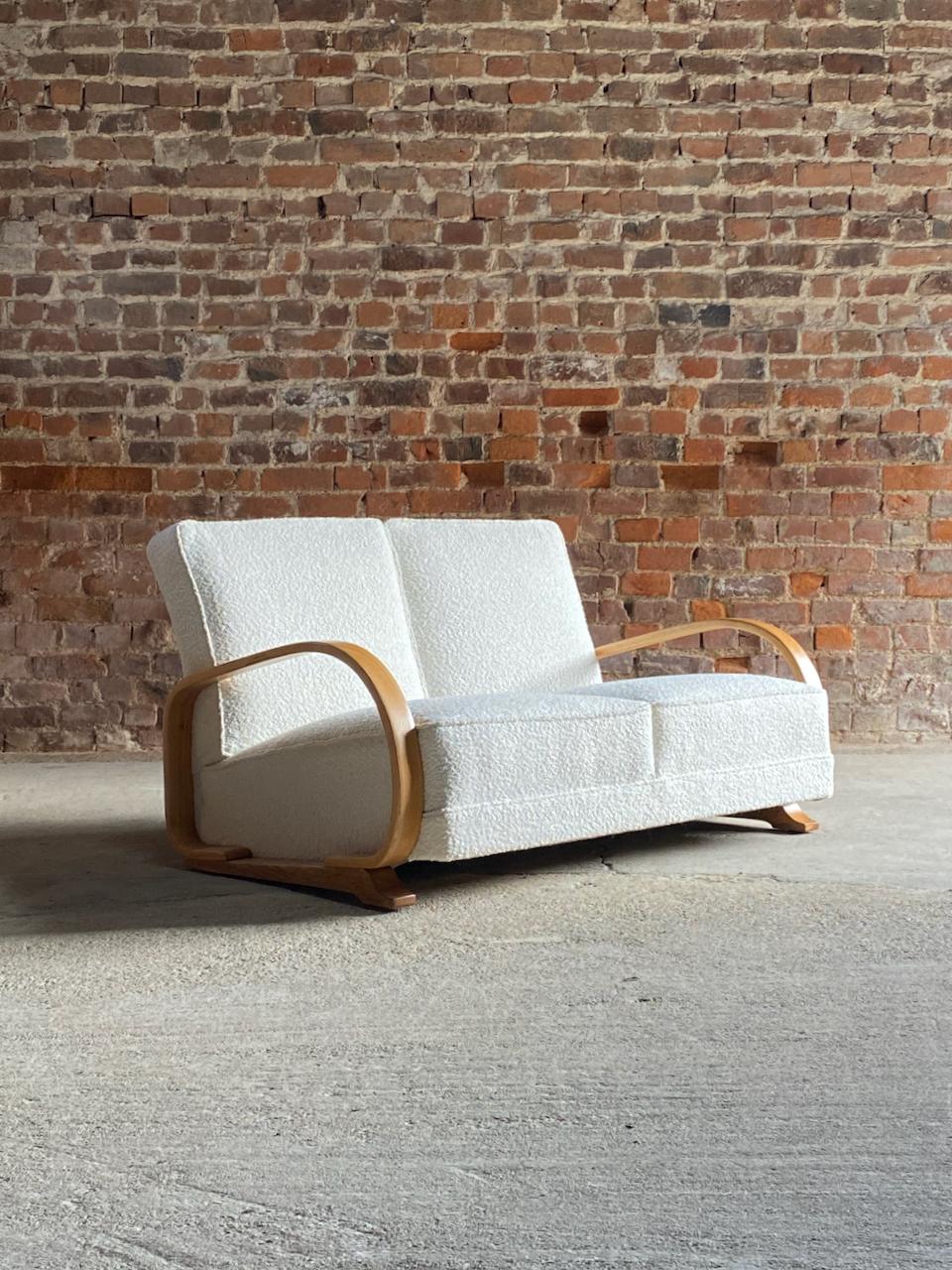 Art Deco Gilbert Rohde streamline sofa by Heywood-Wakefield 1930

Magnificent Art Deco Gilbert Rohde streamline sofa by Heywood-Wakefield USA circa 1930, with bentwood arms and newly upholstered in Boucle upholstery, considered to be one of