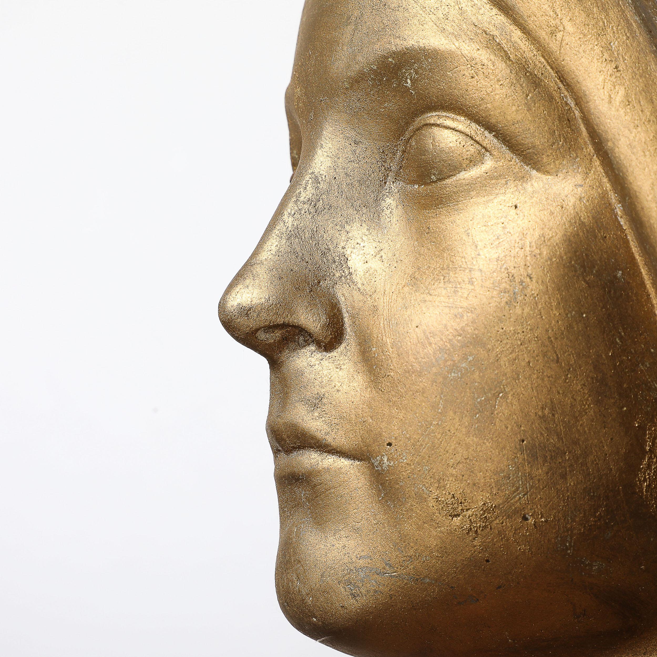 This beautifully achieved Art Deco Gilded Plaster Wall Plaque originates from the United States, Circa 1930. A well formed and elegantly proportioned piece, this plaque depicts a female portrait with subtle features and a hair framing the face, with