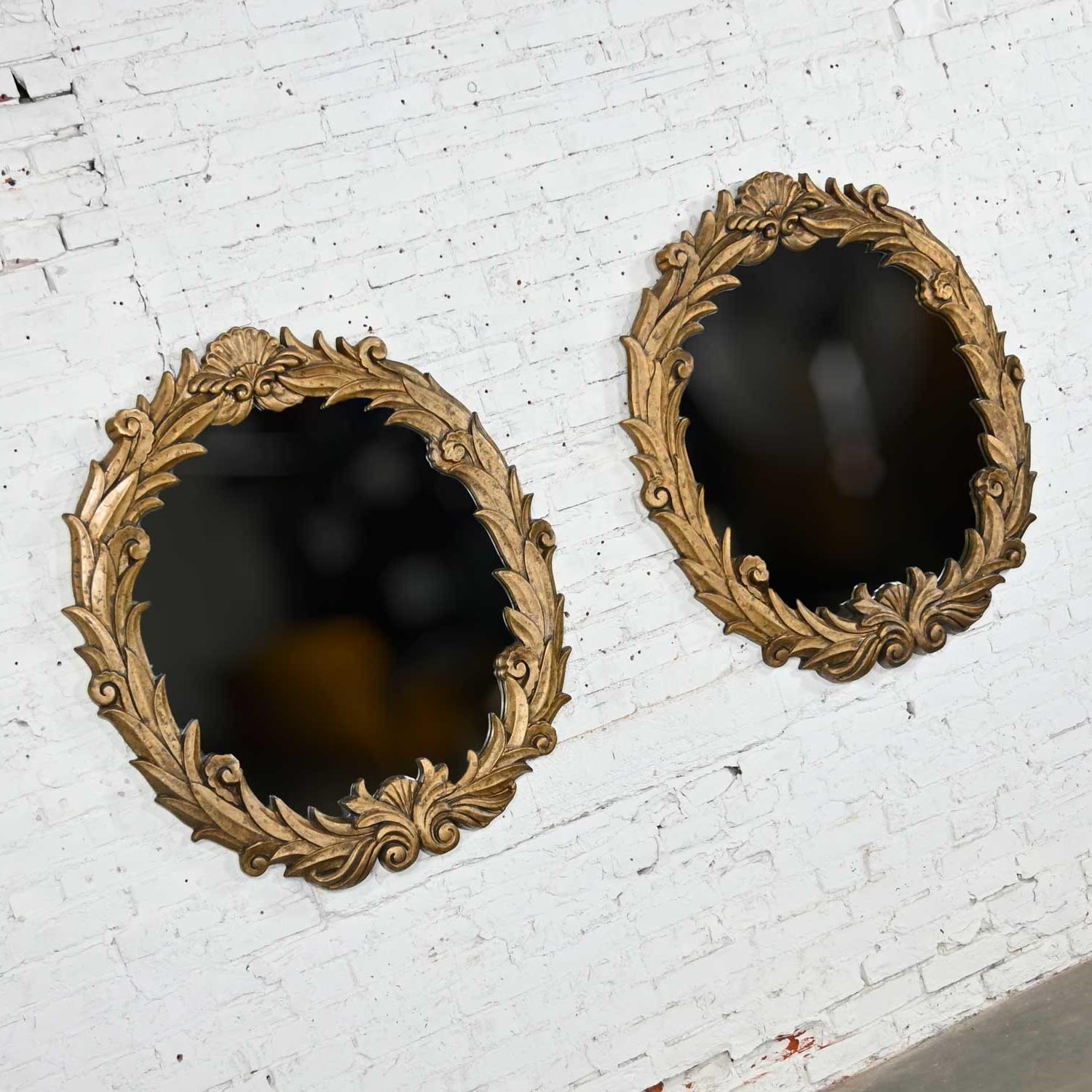 Amazing pair of Art Deco gilded resin mirrors with anthemion or foliate design in the style of Serge Roche. Beautiful condition, keeping in mind that these are vintage and not new so will have signs of use and wear. Please see photos and zoom in for