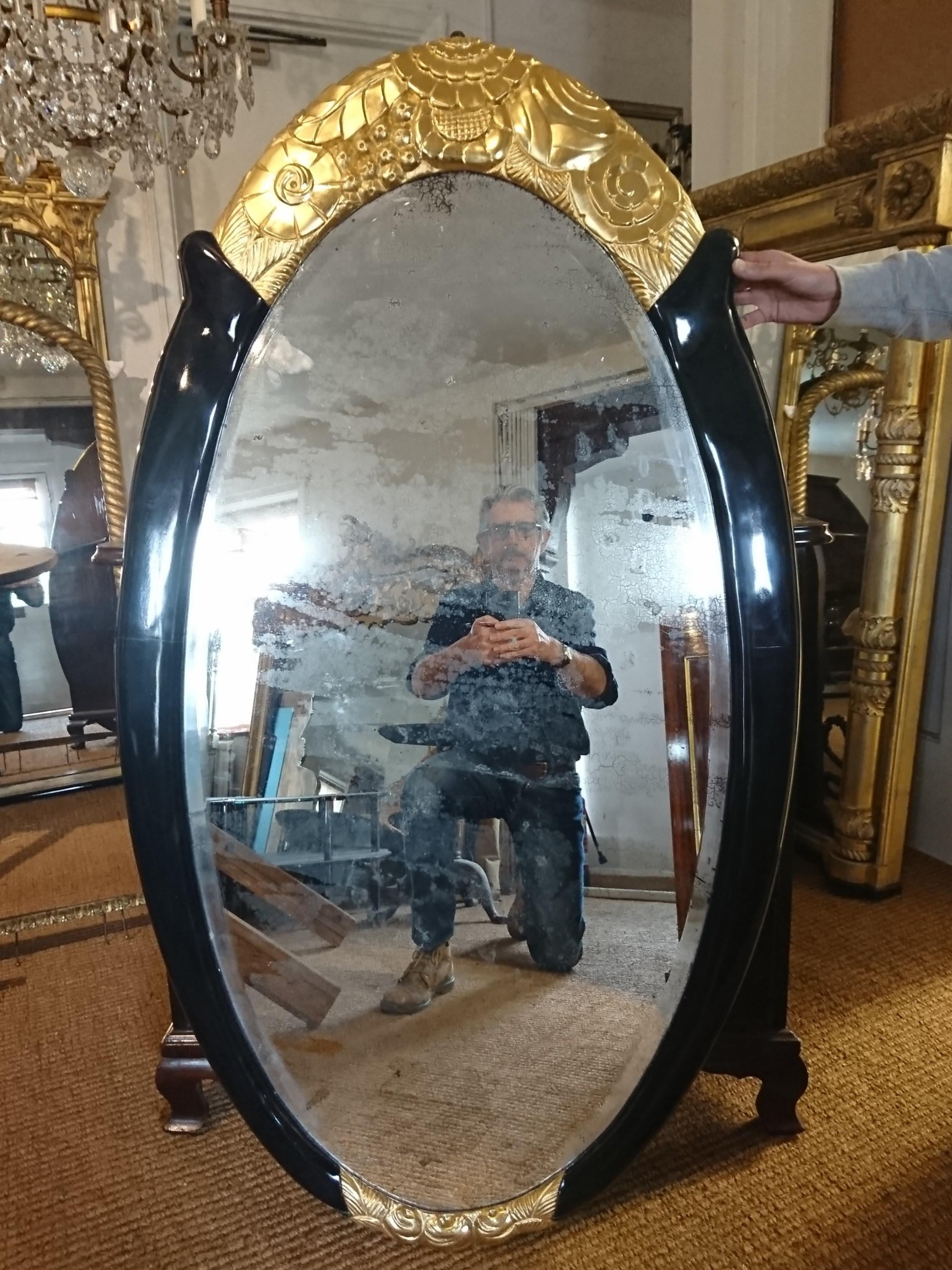 French Art Deco Gilt and Black Lacquer Framed Oval Mirror Attributed to Süe et Mare For Sale
