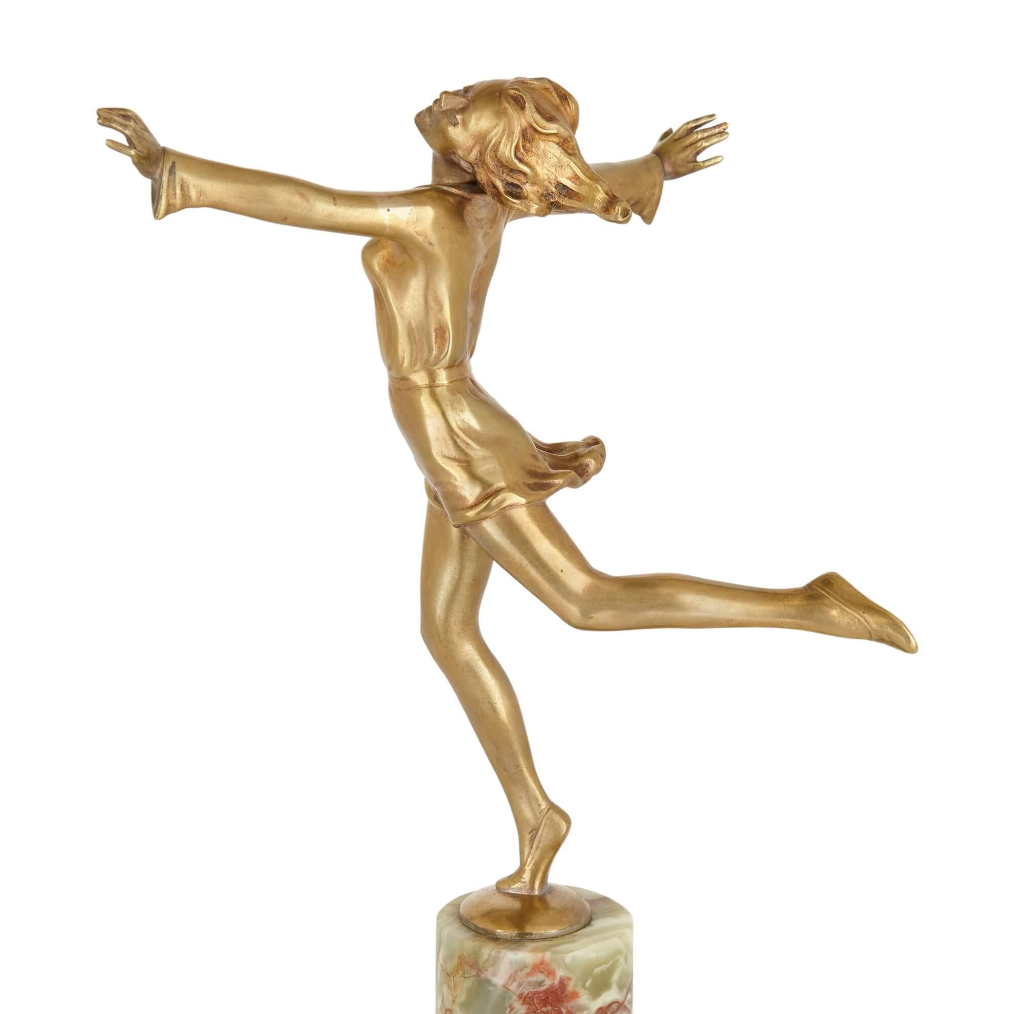 Carved Art Deco gilt bronze and onyx figure of a dancer by Lorenzl For Sale