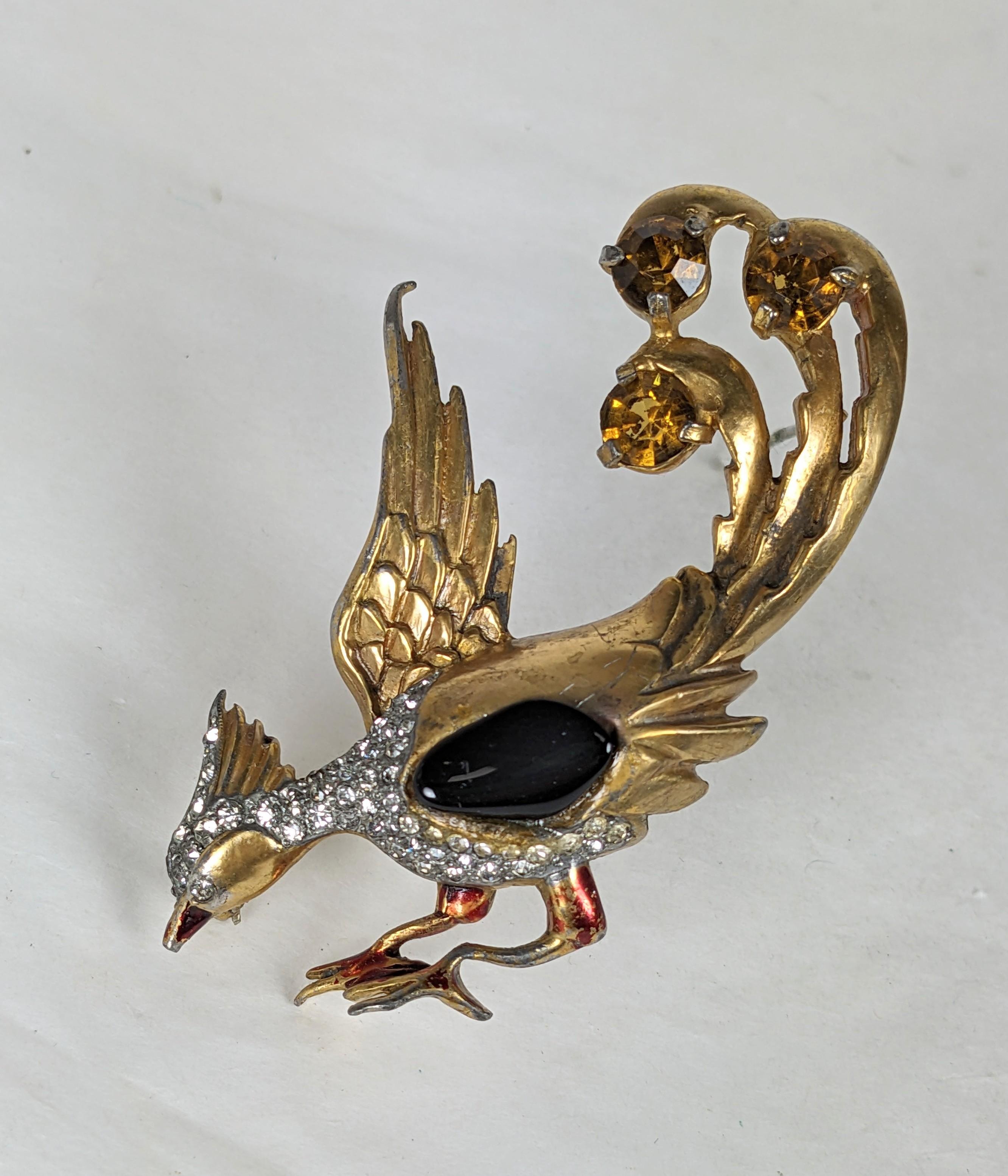 Charming, animated Art Deco Peacock Brooch from the 1930's. Gilt metal with pave accents, citrine crystals and a jet 