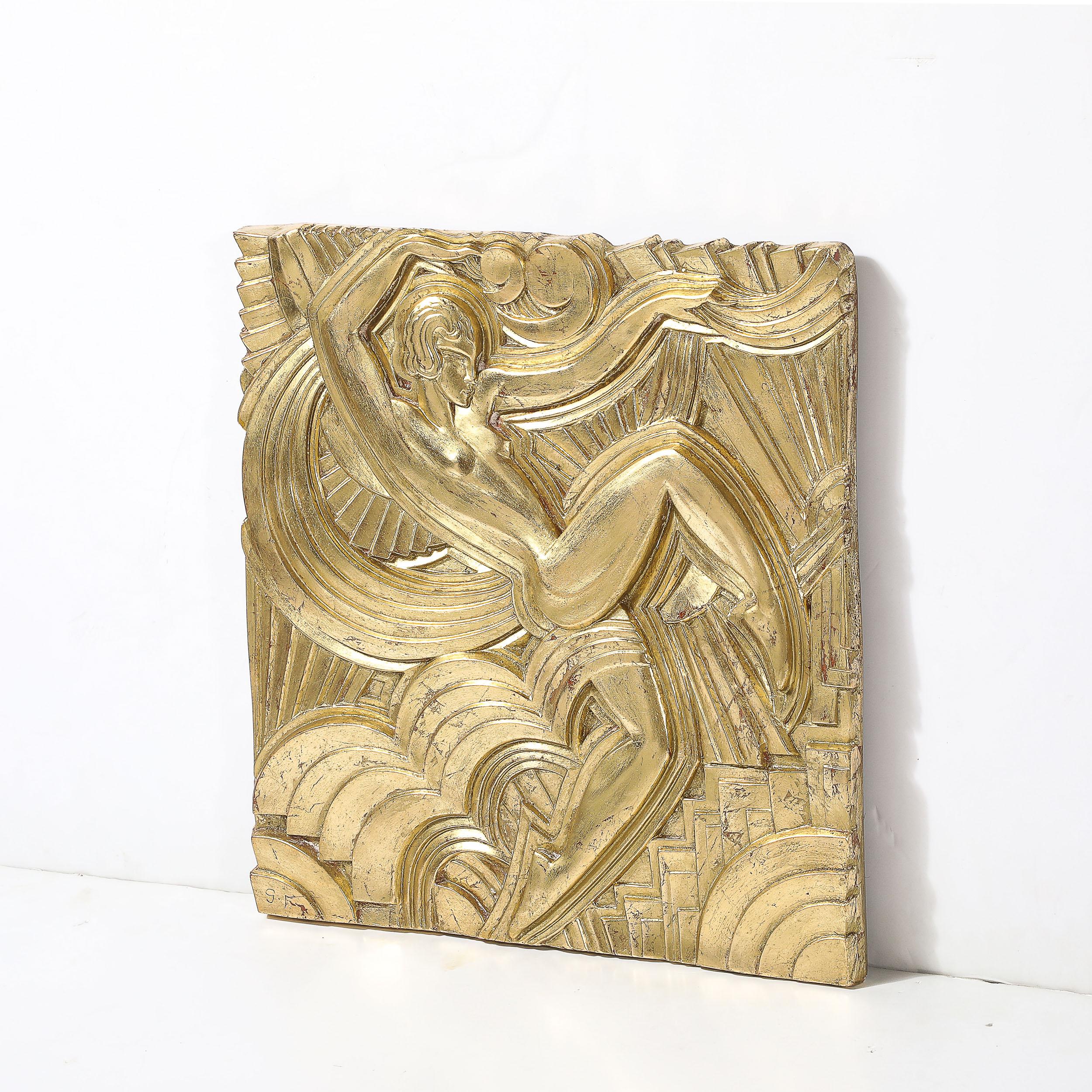 This stunning Art Deco giltwood plaque was realized by the esteemed artist Maurice 