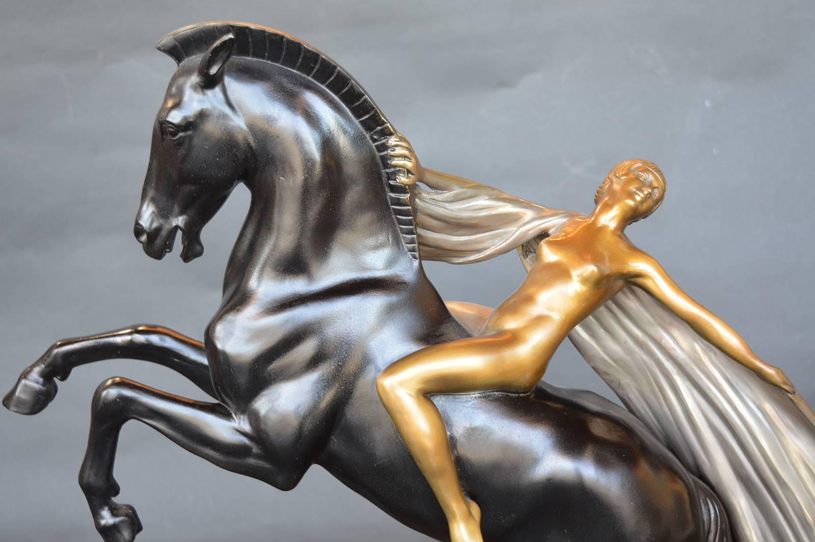 Solid bronze Art Deco nude girl on a horse signed Charles.