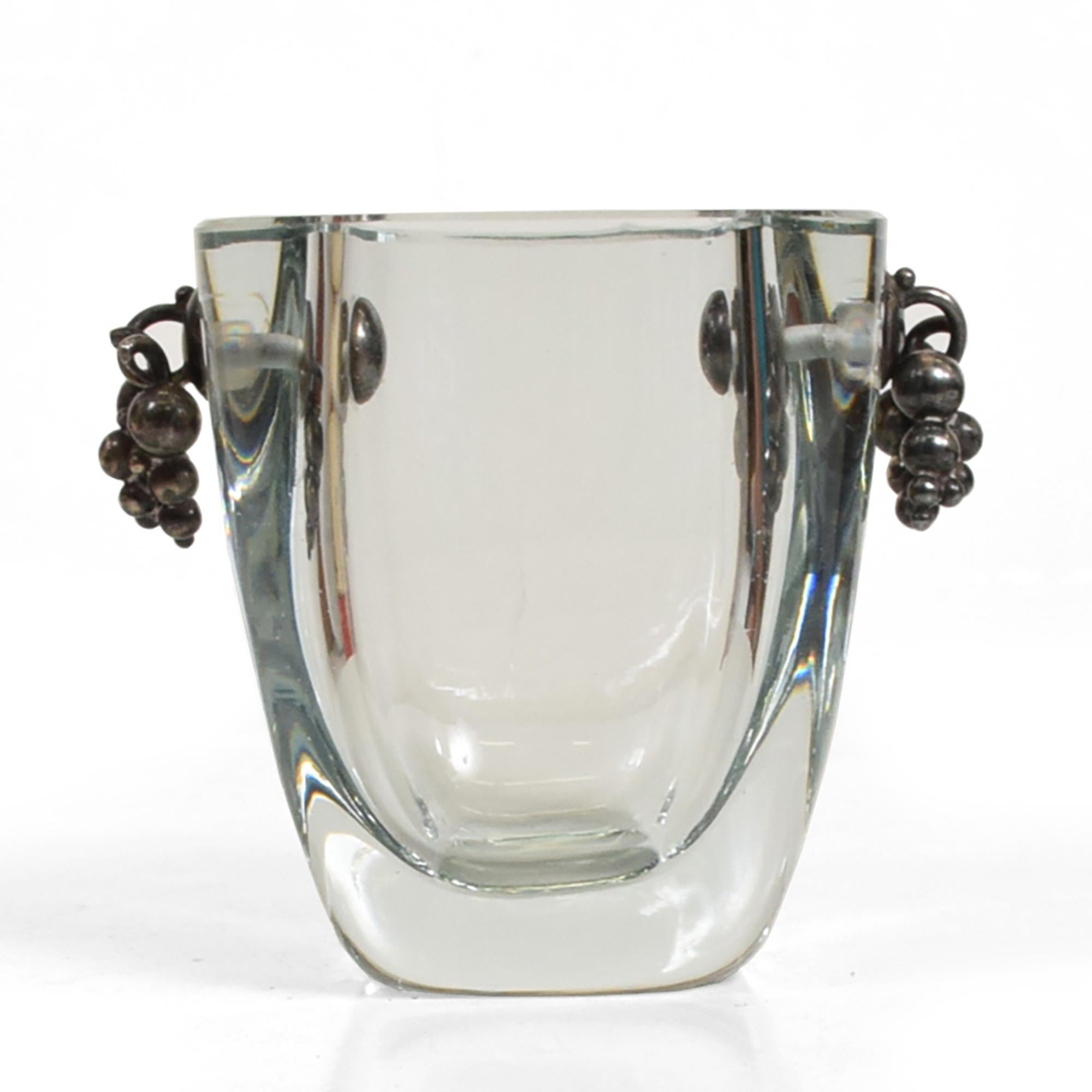 Art Deco modern glamour by Strombergshyttan Thick Swedish crystal glass vase with sterling silver grape clusters, 1960s.
925 sterling silver grapevine shows signature stamp.
Vintage Small very thick crystal vase with 925 sterling silver