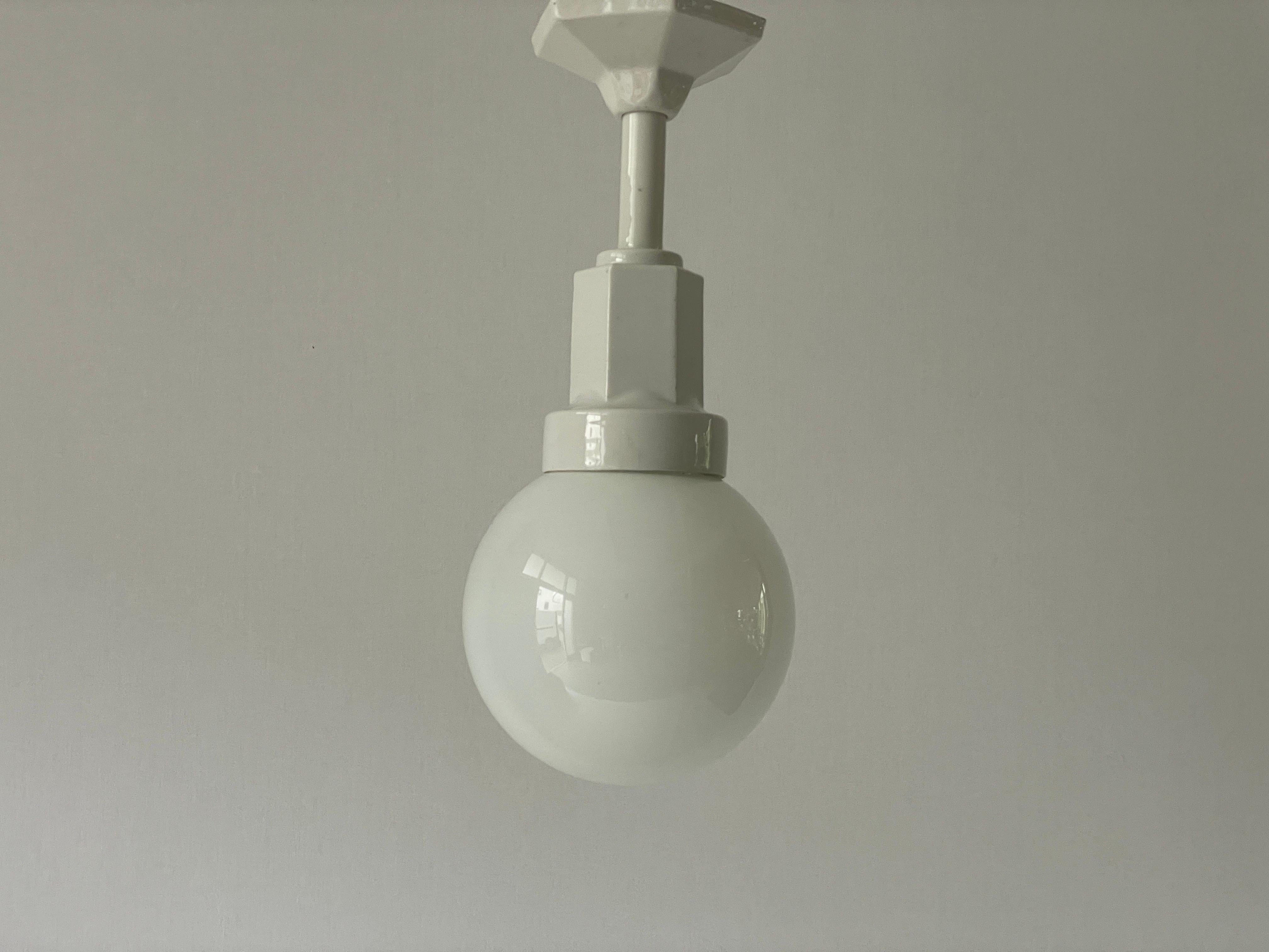 Art Deco Glass Ball and White Ceramic Body Pendant Lamp, 1950s, Italy

Lampshade is in very good vintage condition.

This lamp works with E27 light bulbs. 
Wired and suitable to use with 220V and 110V for all countries.

Measurements: 
Total Height: