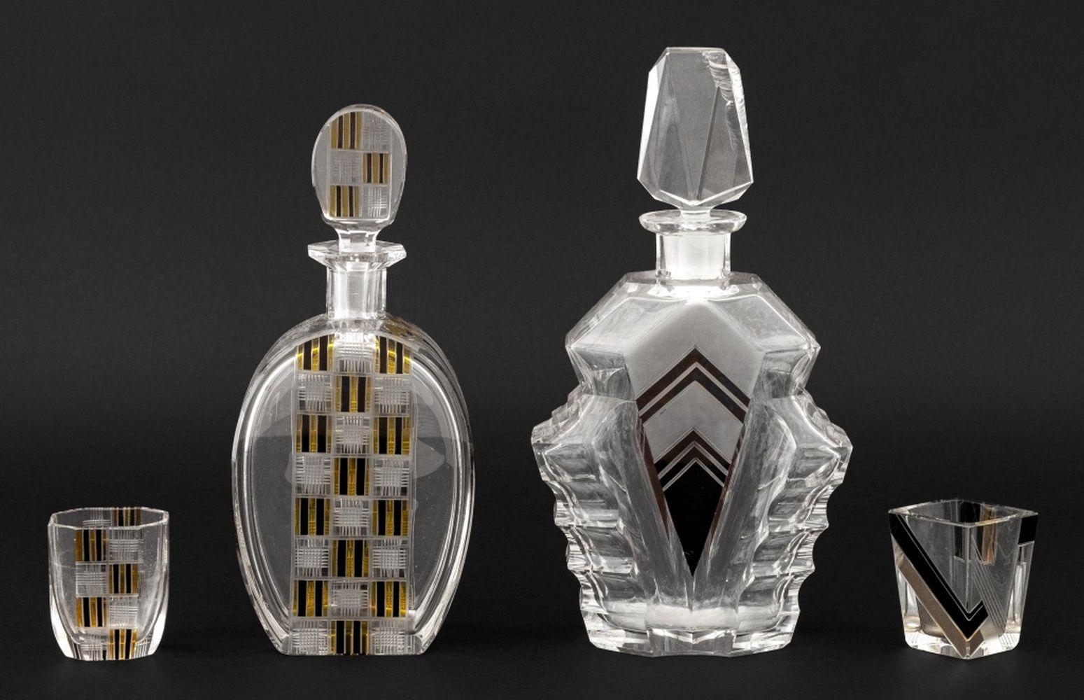 Collection of Four Art Deco Glass Barware Pieces, comprising: Karl Palda attributed black enamel decanter and matching shot glass and black and yellow enamel decanter and matching shot glass. Largest: 10.5