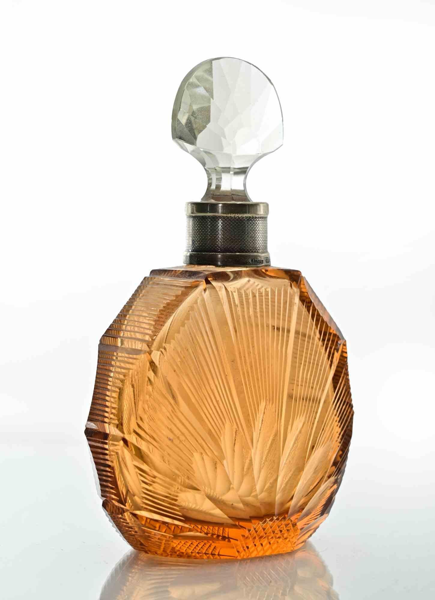 Art Deco Glass Bottle realized in 1930s.

Sterling silver neck, marked on base.

Excellent condition.