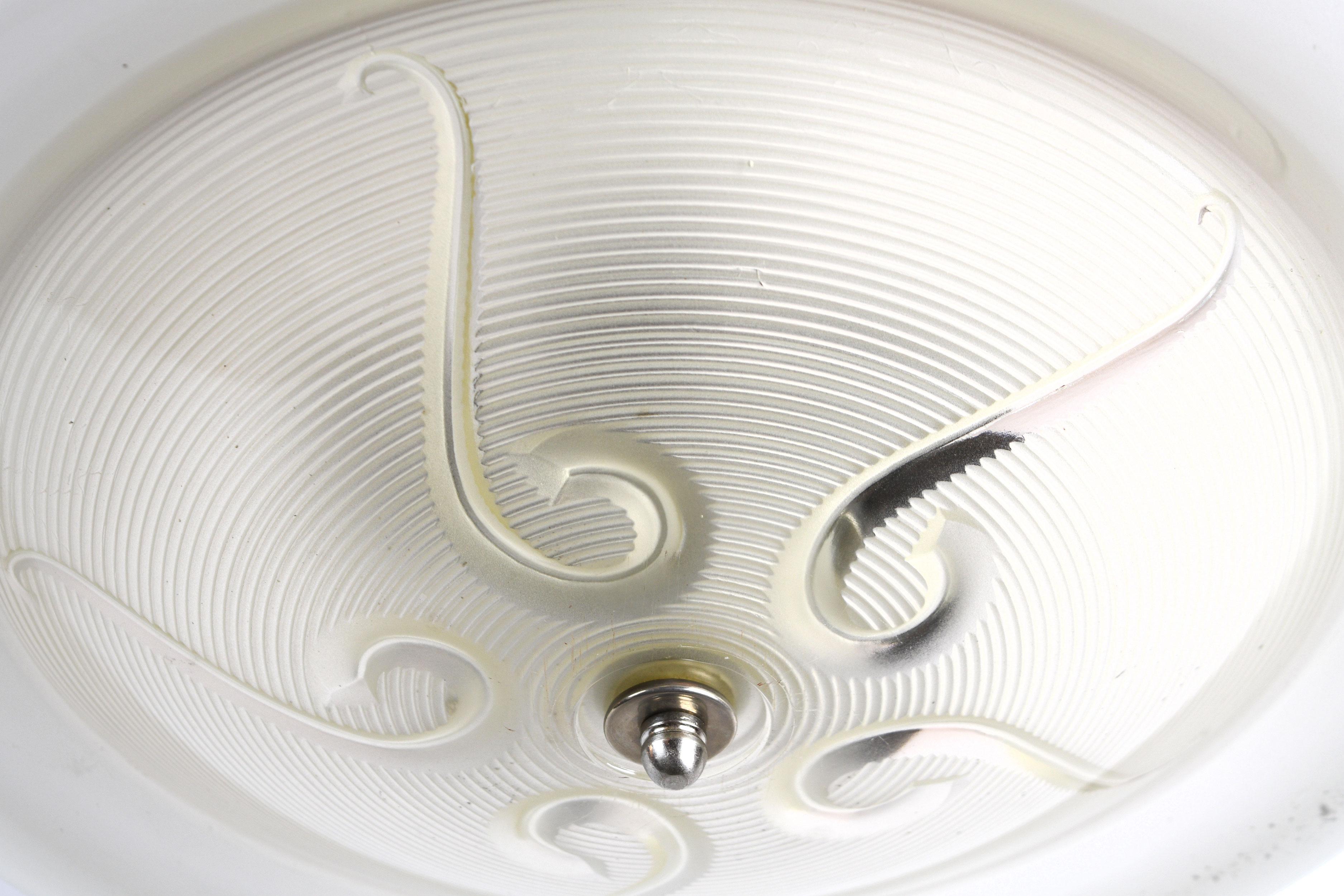 This elegant single shade pendant will bring a glow to any space. While the soft colors and translucent shade are calming, the 5 bulbs will perfectly light any space. The white and clear glass complement the faded chrome of the flushmount and each