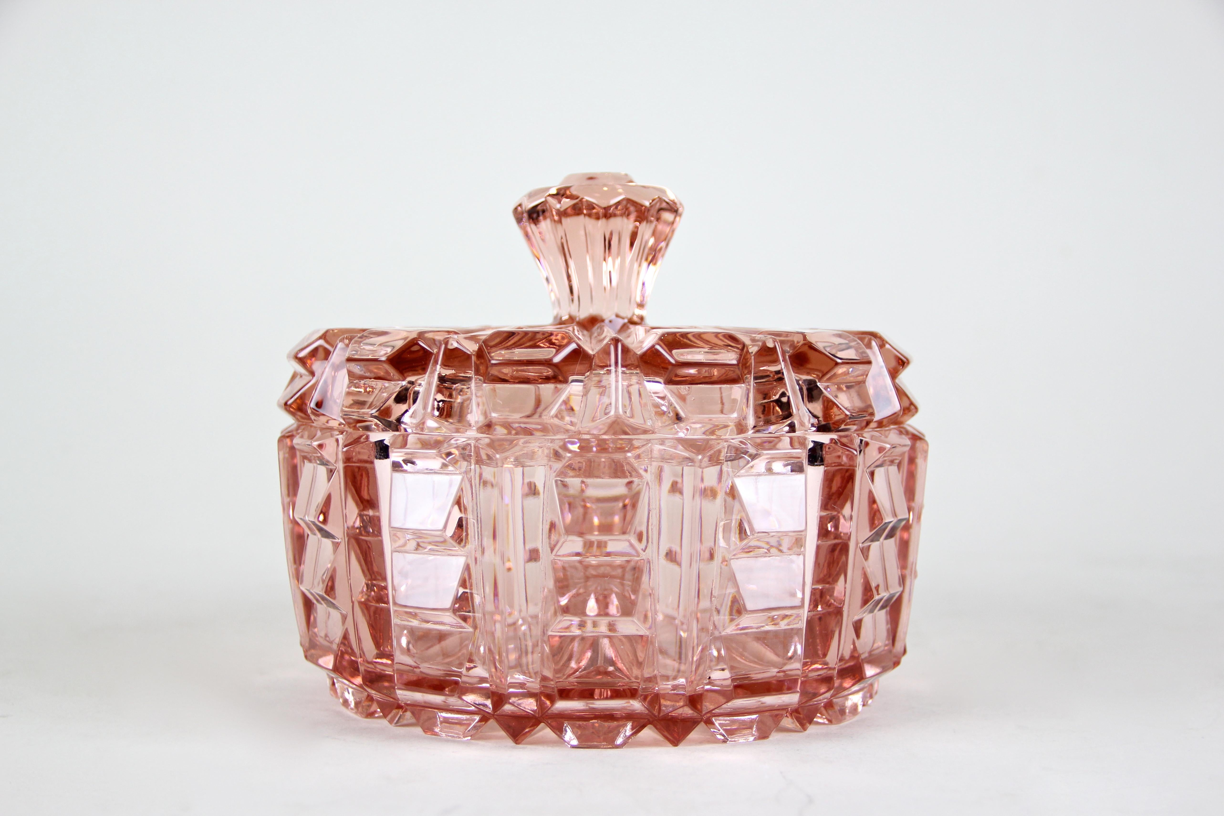 Very lovely Art Deco Glass Bowl with Lid from the period in Austria around 1930. The beautiful rose colored pressed glass impresses with an outstanding design. A great shaped glass lid completes the fantastic look of this artfully made glass bowl.