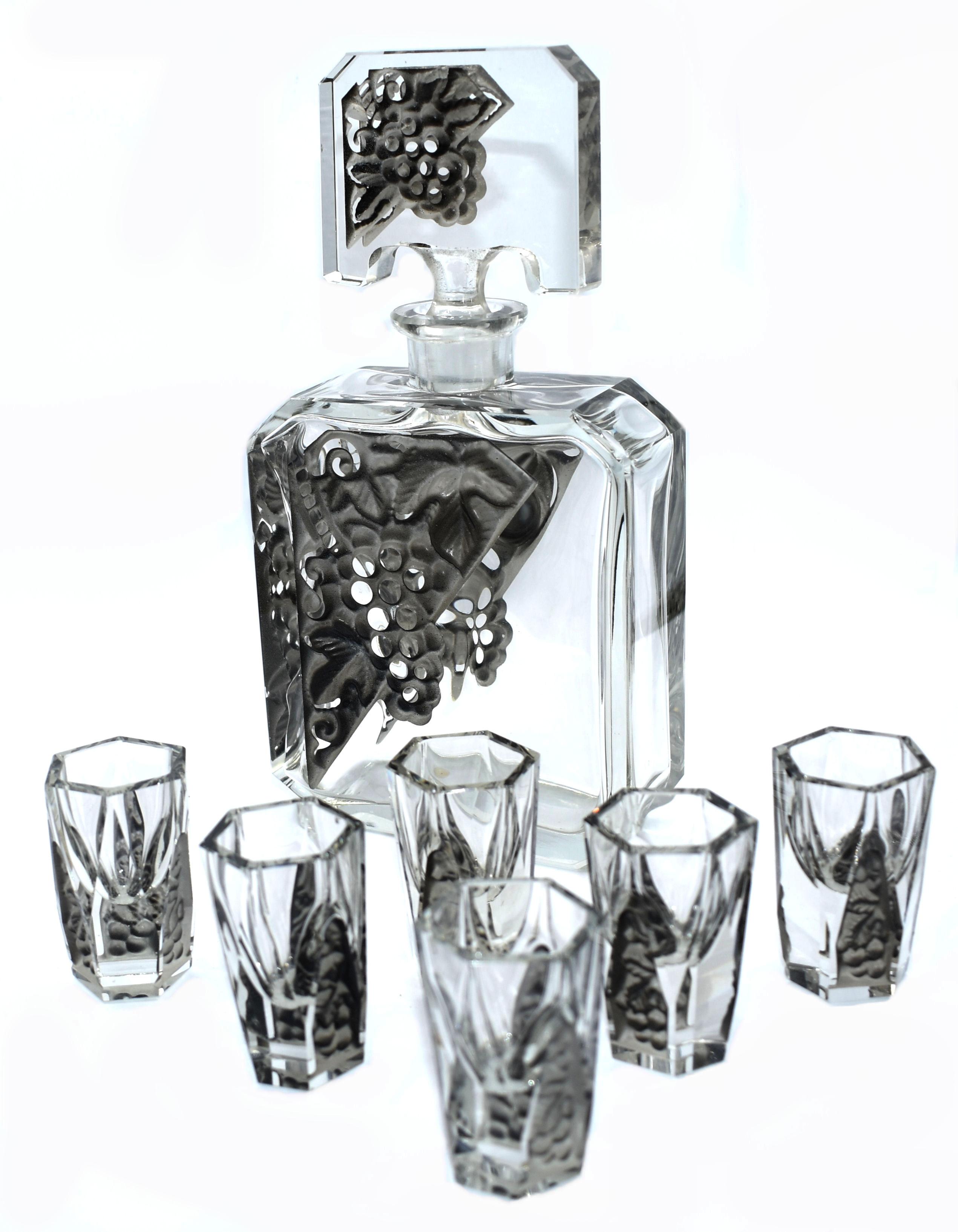 For your consideration is this fabulous Art Deco decanter set with 6 matching glasses, intricately detailed facet-cut glass with acid mat relief panels in a clear glass, manufactured by Curt Schlevogt, who established his own glass company in 1928