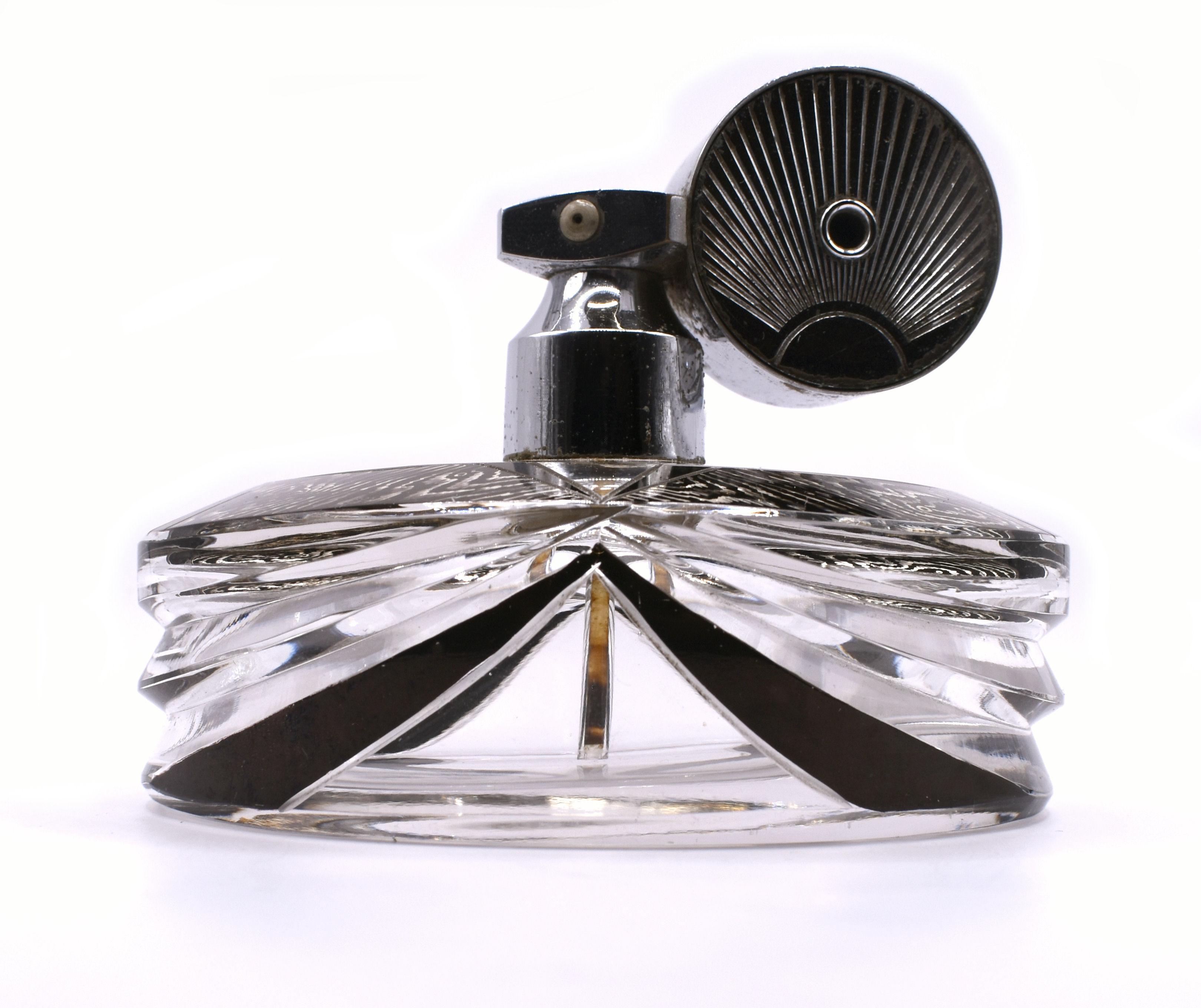 A beautiful Art Deco glass ladies atomizer bottle dating to the 1930’s very much in the style of Karl Palda. The enamel and etched decoration is in superb condition and shows minimal signs of wear. Beautiful enamelling in black and silver, very