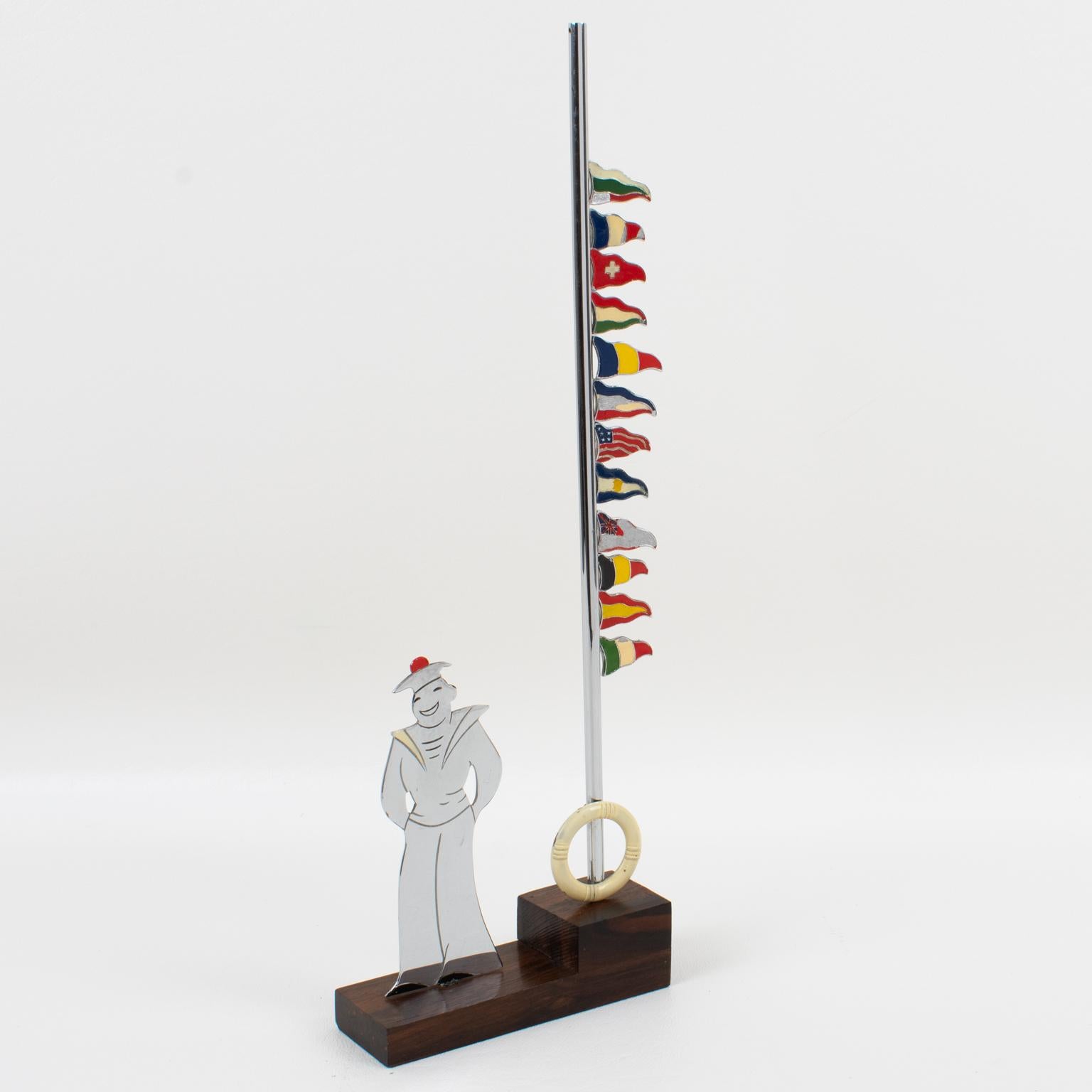 Sudre, Paris designs this stunning French Art Deco barware accessory glass-markers for cocktails and parties. The bar piece features a chromed metal silhouette of a French Navy sailor with enameling details and a tall pole holder. The Pole holder is
