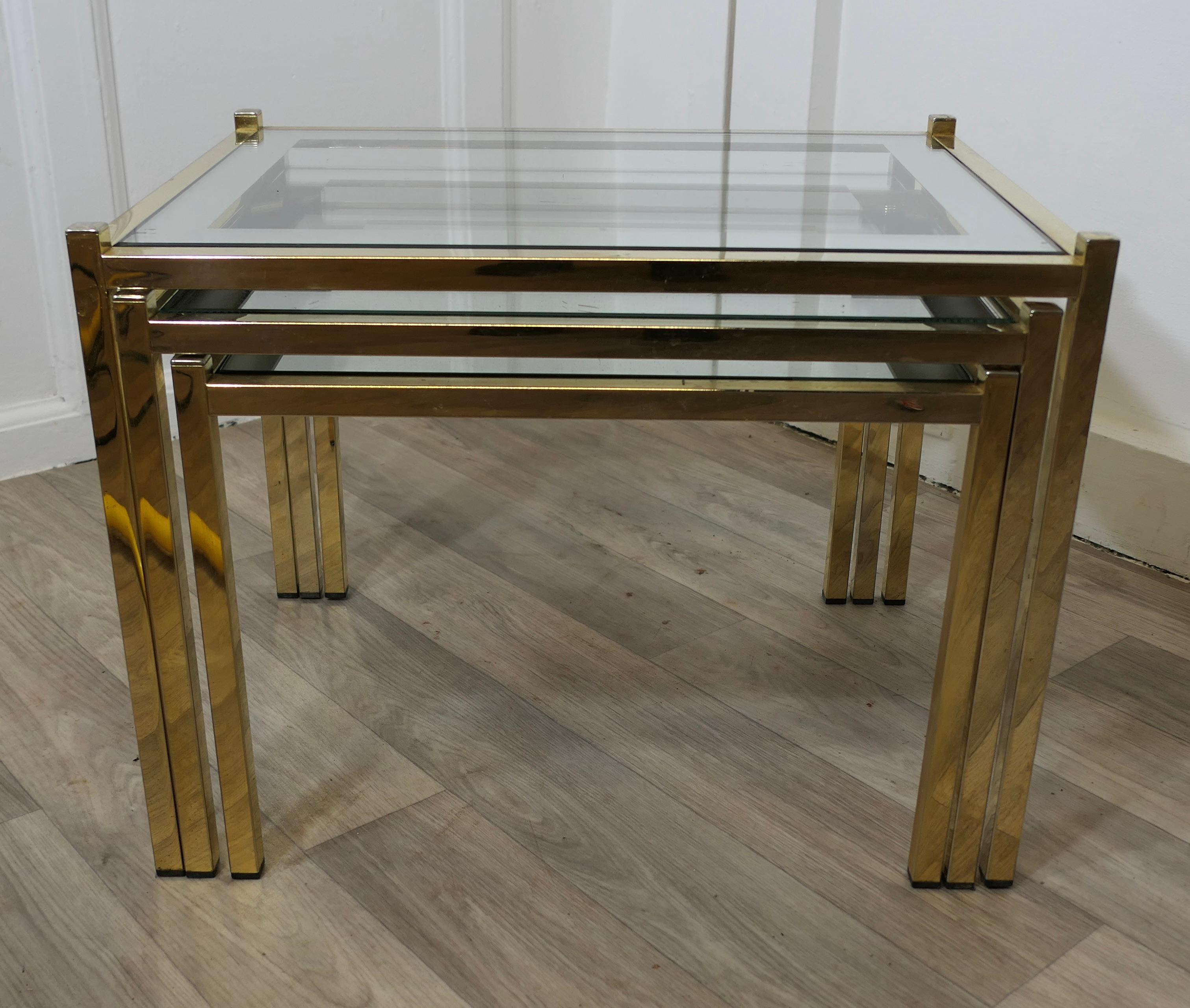 Art Deco Glass Mirror and Brass Nest of Tables

This is a very stylish good-looking set of tables, the glass table tops are bordered with mirror and these are set in brass frames
The tables are sound and in good condition with age related wear, as