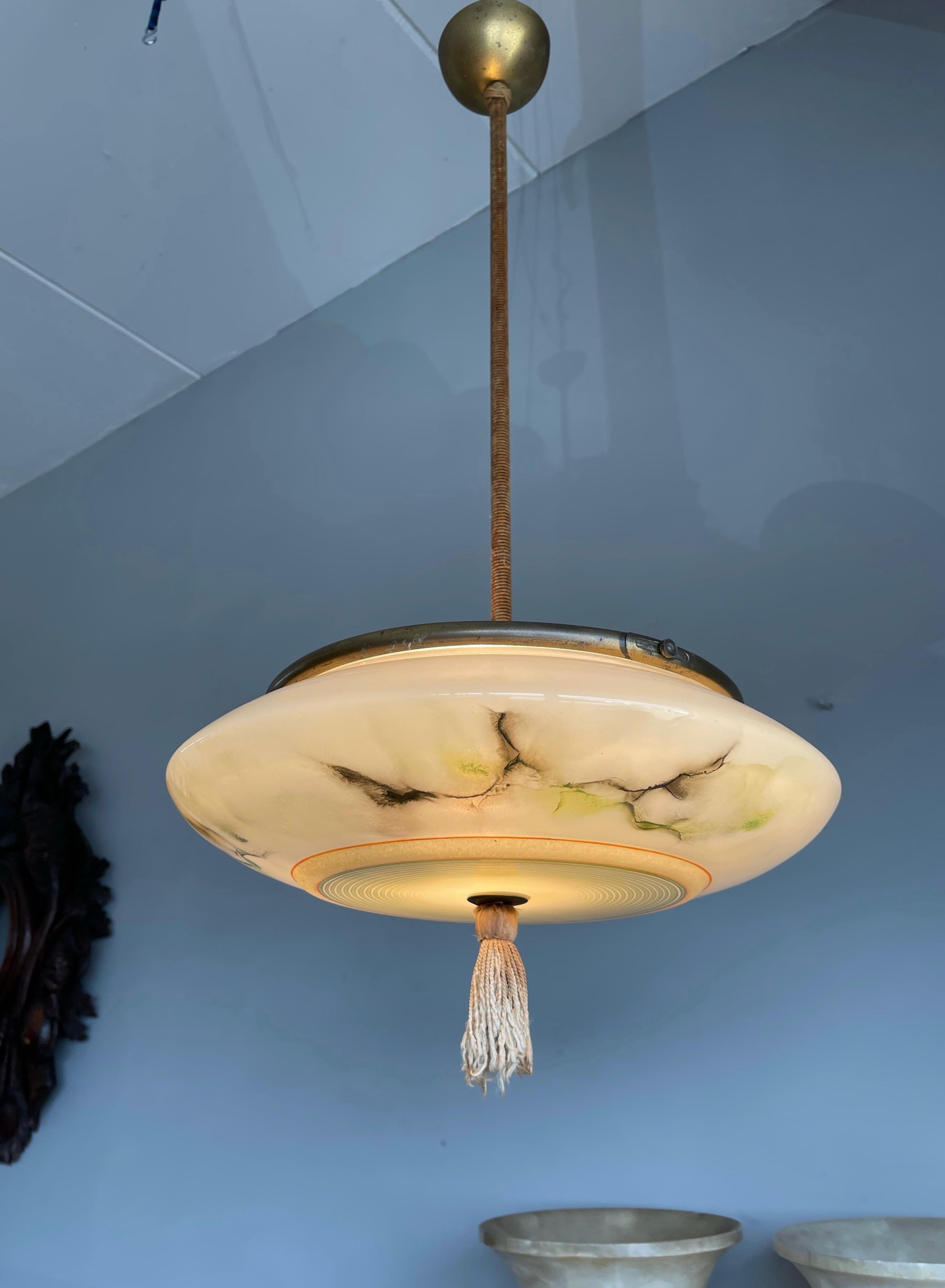 Stylish and outstanding shape Art Deco light fixture from the 1920s.

There is a perfect pendant light for every room. That is what I thought when I first saw this Art Deco fixture, because I know that it is just a matter of time before that room
