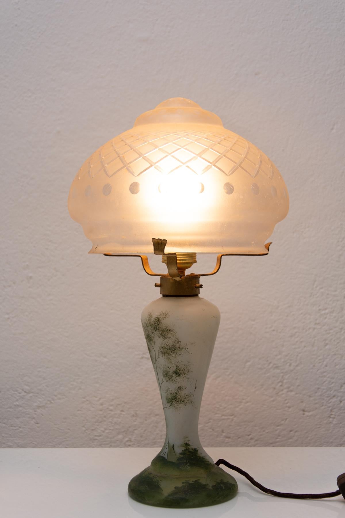 This glass ART DECO lamp was made in the former Czechoslovakia in the 1930´s. The lamp stands out for its extraordinary shapes typical of the Art Deco period. Overall, it is in very good condition, has a new wiring.