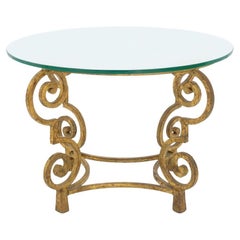 Mesa auxiliar circular Art Decó de madera dorada con tapa de cristal