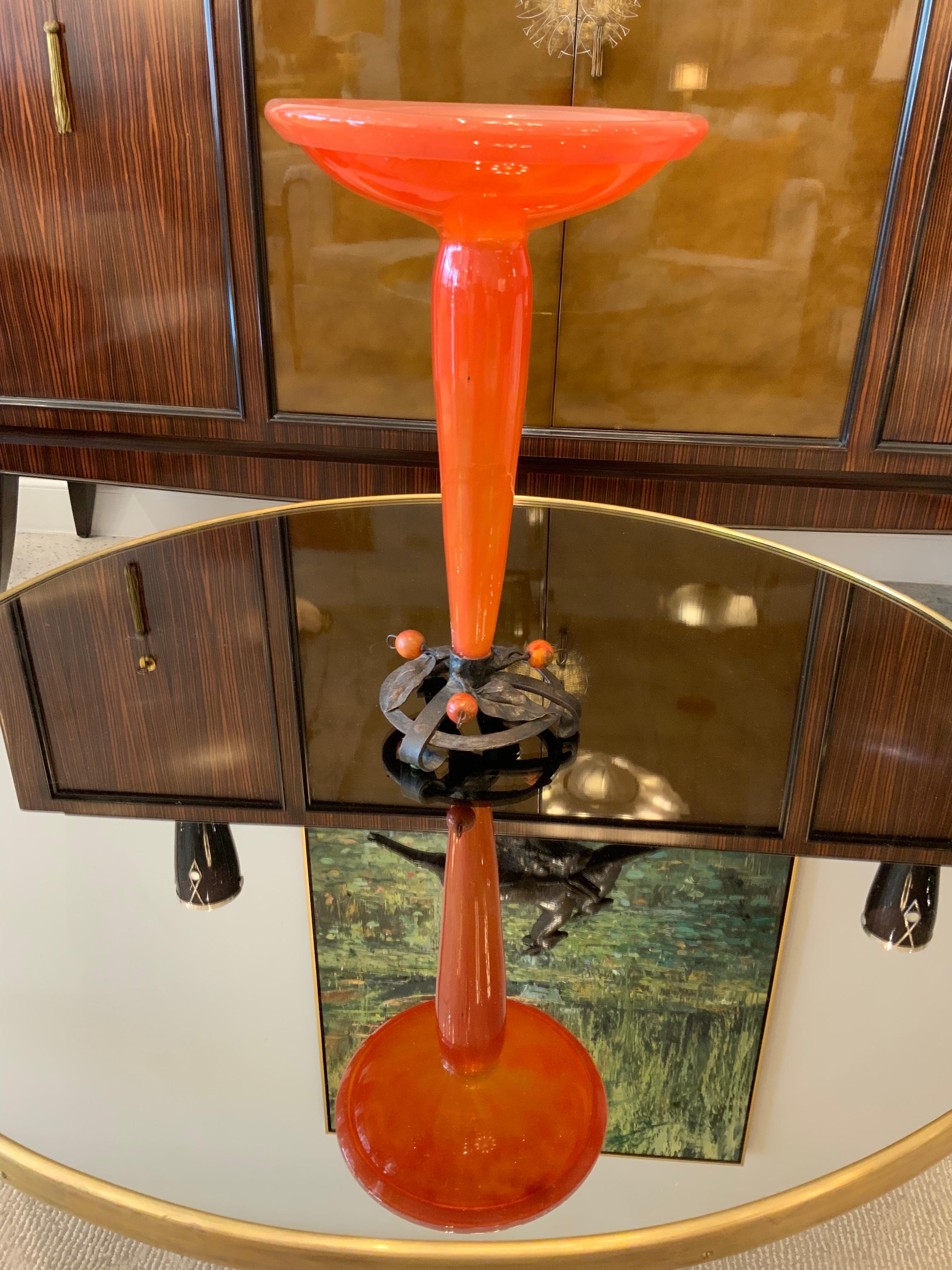 A beautiful Art Deco glass vase by Charles Schneider in a red tango colored with wrought iron details.
Signed: Schneider.
