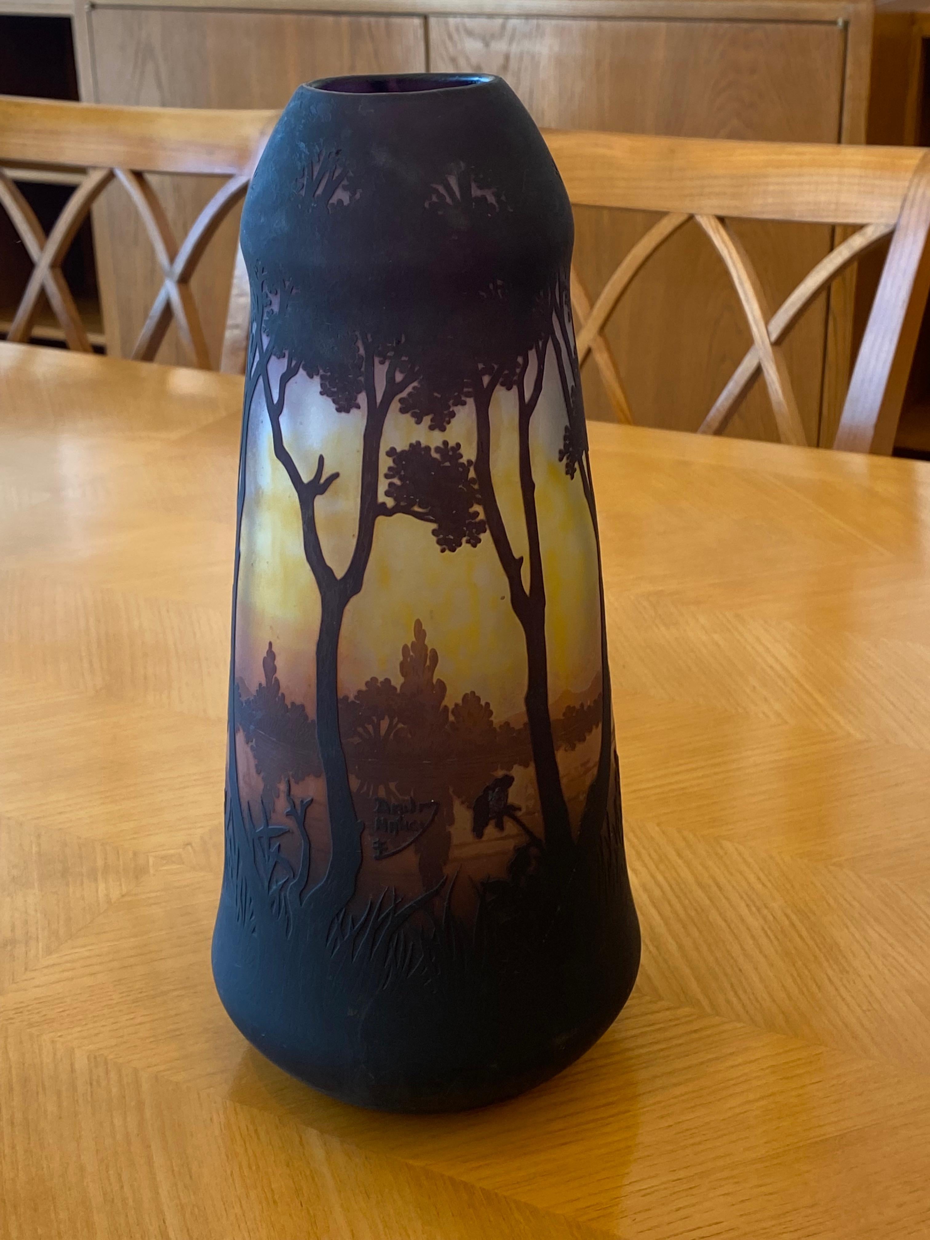 An exquisite Art Deco Cameo glass vase in dark yellow tones with a scenic view in brown hues. Signed by Daum-Nancy.
Made in France.
Circa: 1920.