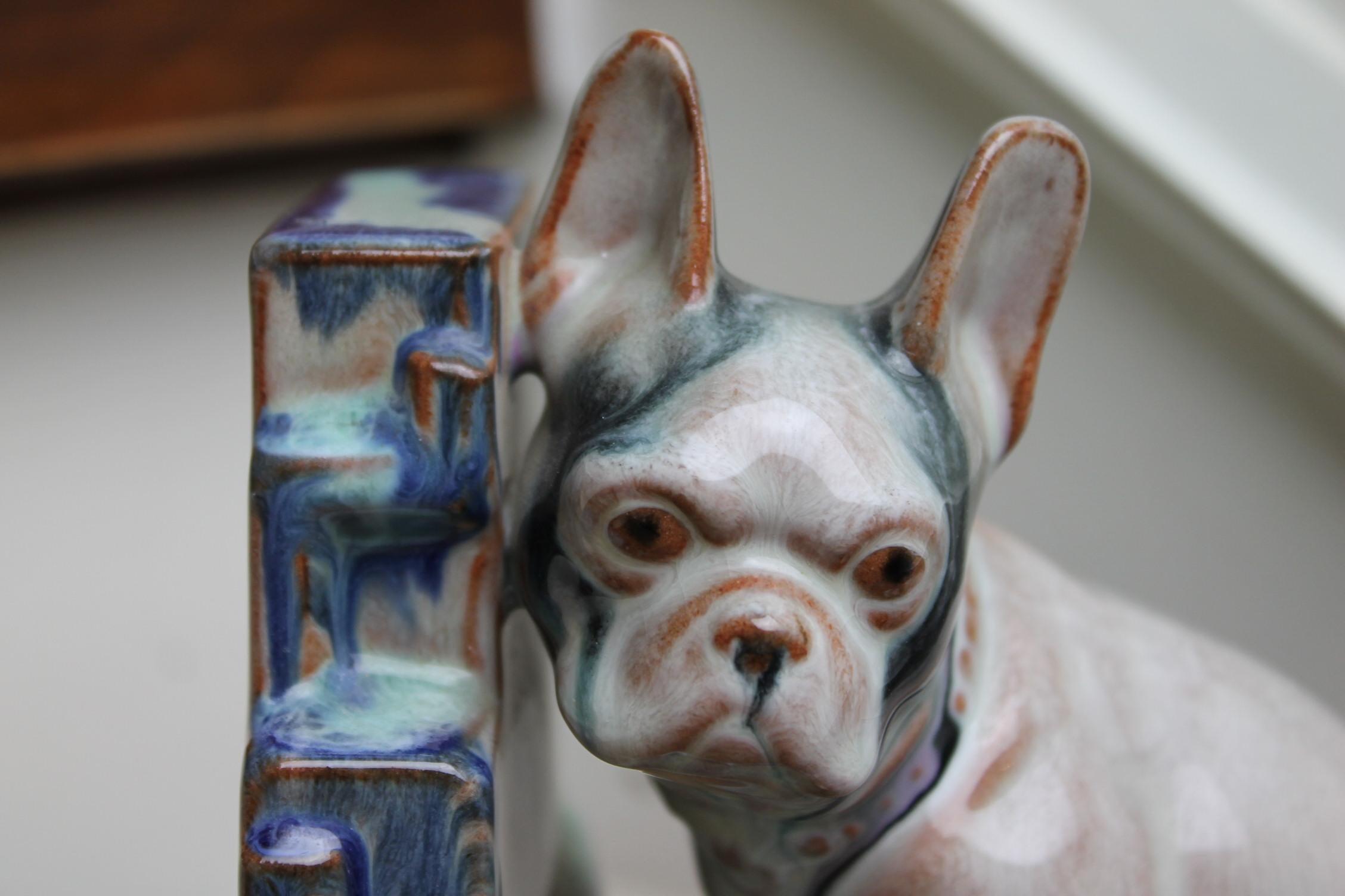 Art Deco bulldog figurine, bookend, statue.
Awesome combination of colors blue, green, brown and grey.
Glazed pottery, drip glaze statue, typical for the Art Deco period.
Marked at the bottom XS 575 and a crown, attributed to Goebel