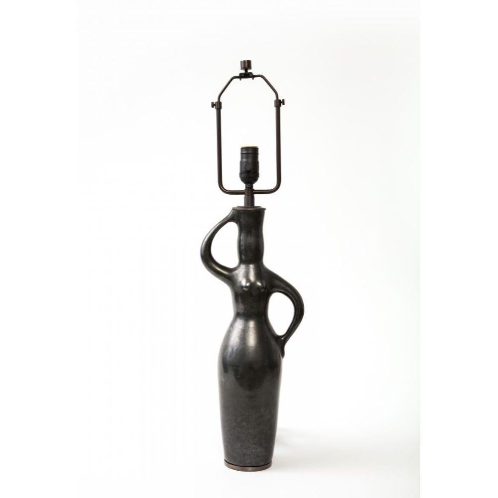 Sleek, elegant table lamp; possibly unique. Reminiscent of lamps by Jacques Blin and Picasso. Newly rewired with a black twisted silk cord and adjustable shade harp.

