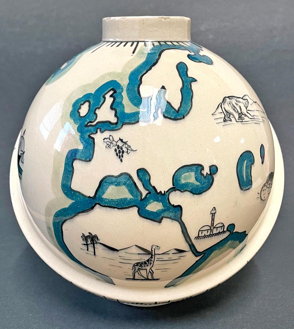 Made by the brilliant, iconoclast Robert Lallemant in the 1920s, during the height of the Art Deco style in France, this globe vase -- later converted to a lamp base -- depicts each of the major continents, replete with symbols of their landscapes