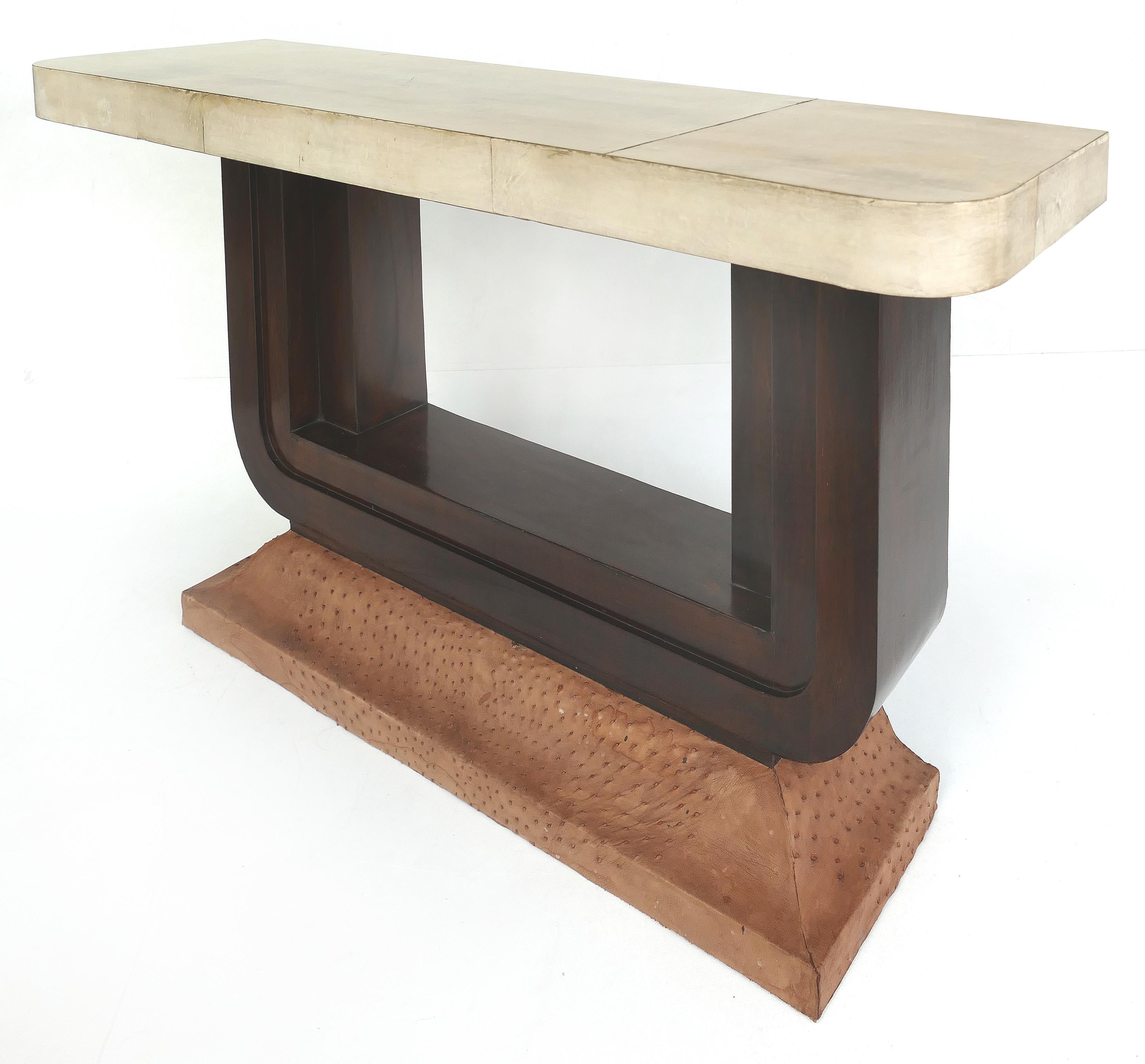 Art Deco goatskin and ostrich clad console tables, pair


Offered for sale is a rare and elegant pair of Art Deco console tables with goatskin clad tops and ostrich skin-clad bases. The tops are supported by 