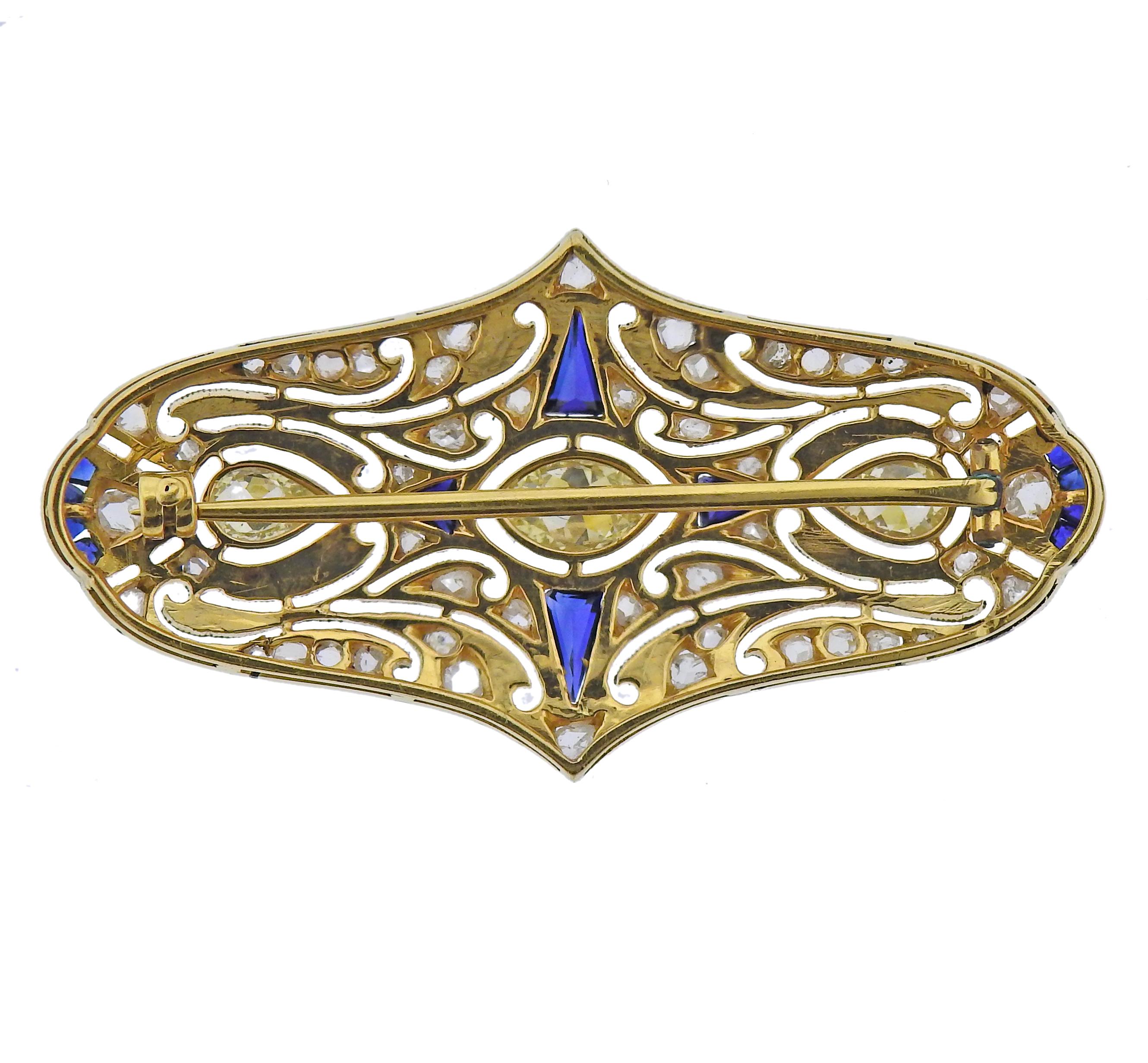 Art Deco 14k gold brooch, with sapphires and approx. 0.75ctw in three large pearl and marquise 3 diamonds, surrounded with smaller rose cut diamonds. Brooch measures 45mm x 25mm. Weight - 7.7 grams.