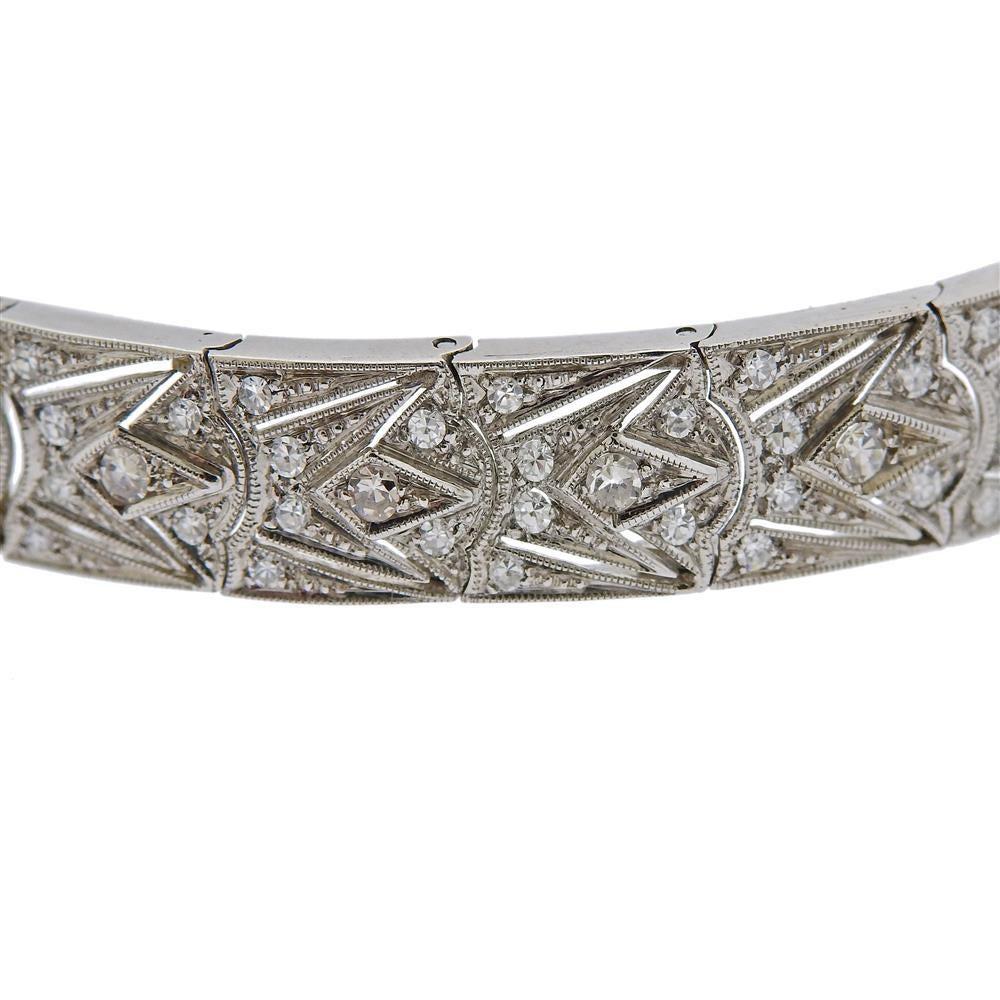 Art Deco 18k white gold watch bracelet, adorned with approx. 1.60ctw in diamonds (one stone is missing). Watch has manual wind movement, in running order.  Dial signed 