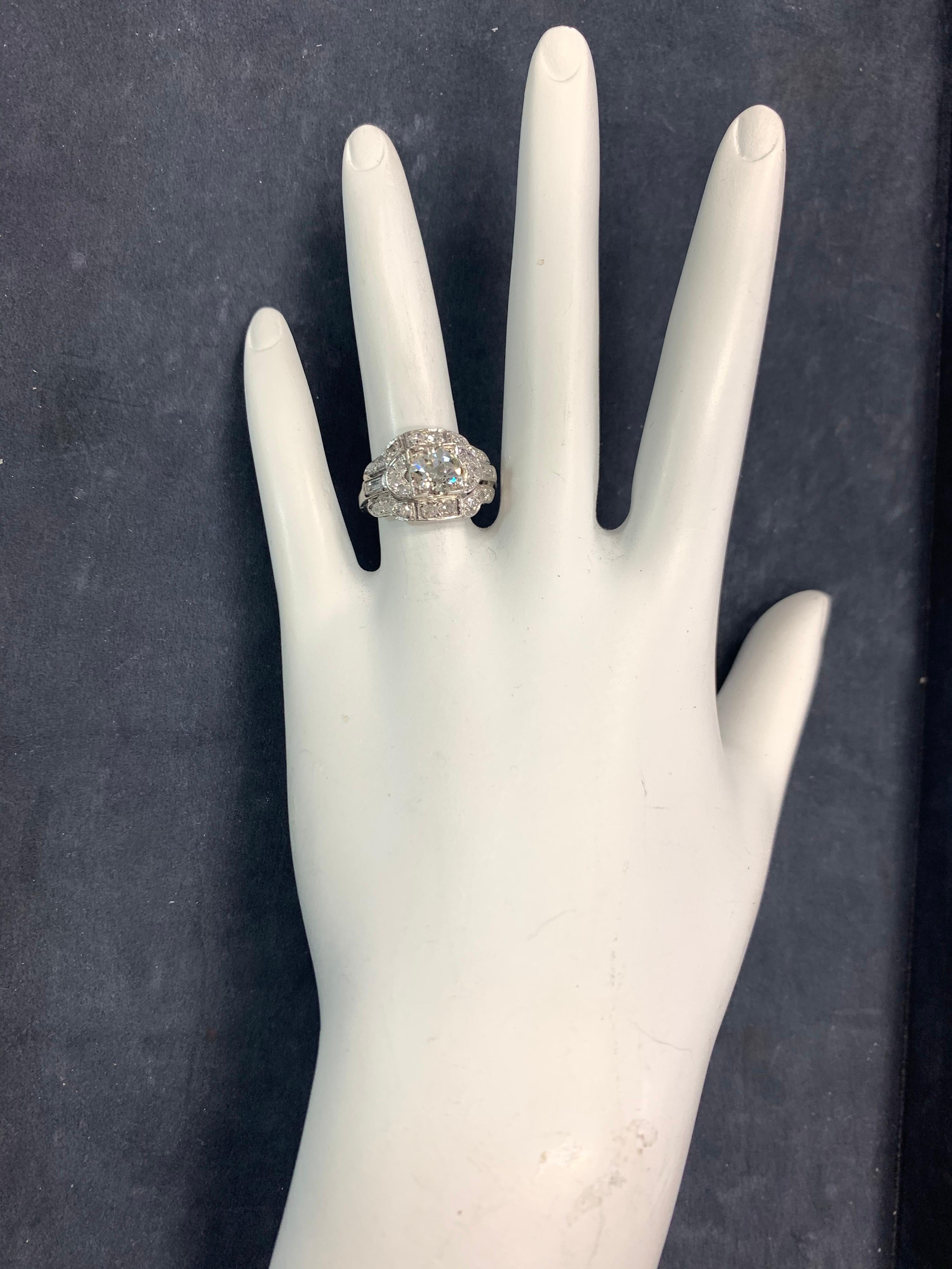 Art Deco Style Natural Diamond Ring set in 14k White Gold, size 6.25. 

The center stone is an approximate 0.95 carat Old European Cut Natural Diamond 6.4x4mm, H-I color and I clarity. 

Set on the gold mounting are 22 round brilliant diamonds and