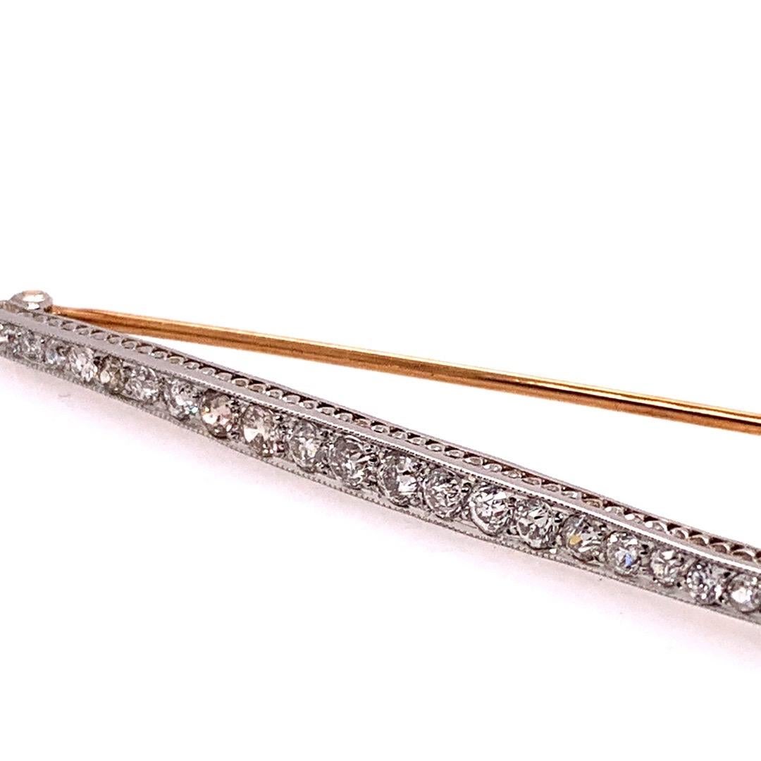 Art Deco Gold Pin, APPROXIMATELY 1.50 Carats include 23 Natural Old European Diamonds (Appx G-H, VS-SI).

The Brooche weighs 6.1 grams. Circa 1920. 