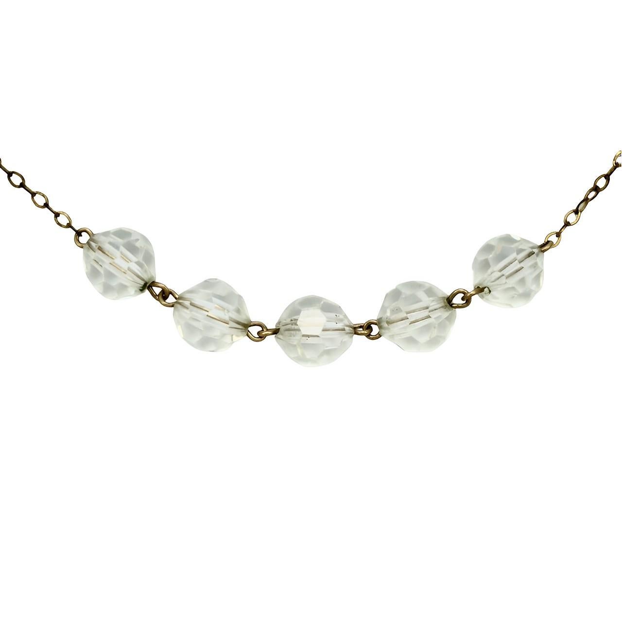 Beautiful Art Deco rolled gold chain necklace, featuring fifteen clear faceted crystal beads. The chain links are soldered. Length 42.1 cm / 16.5 inches, and the crystal beads measure 8 mm / .3 inch. There is some wear to the gold plating.

This