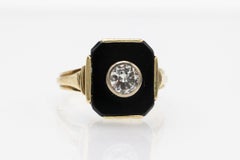 Art Deco gold ring with onyx and 0.70ct old brilliant cut diamond, circa 1930s.