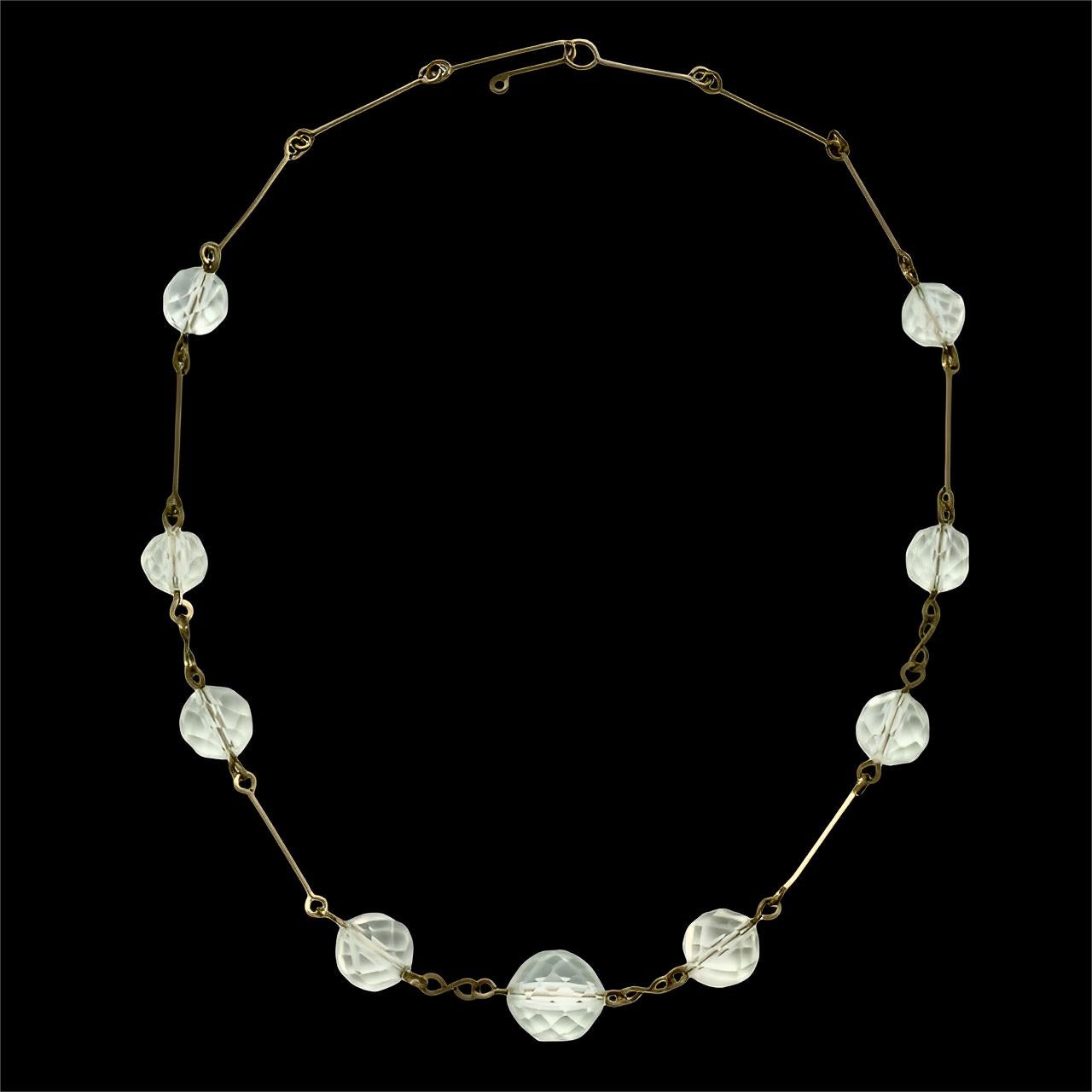 Collier Art Déco en fil d'or avec neuf perles de cristal à facettes circa 1930 Unisexe en vente