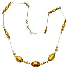 Art Deco Gold Tone Wire Necklace with Oval Golden Foil Glass Beads circa 1930s