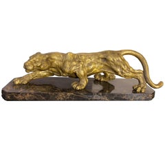 Panther-Skulptur aus goldener Bronze im Art déco-Stil auf schwarzem und goldenem Marmorsockel