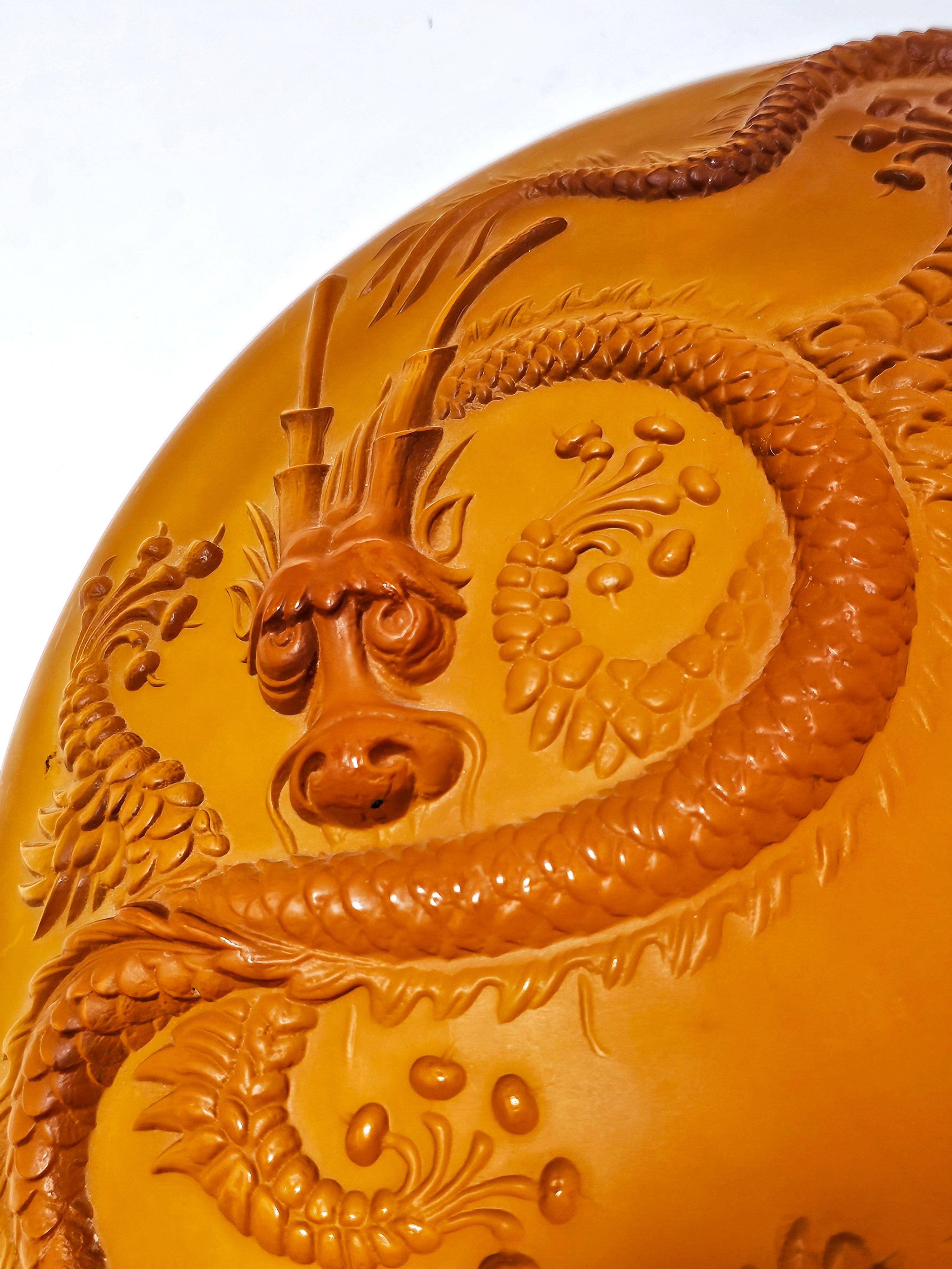 In this listing you will find a breathtaking Art Deco bowl or large serving plate with 3D Oriental style dragons motif that look they are reaching out of the glass. This beautiful amber glass piece was designed by Josef Inwald for Barolac glass