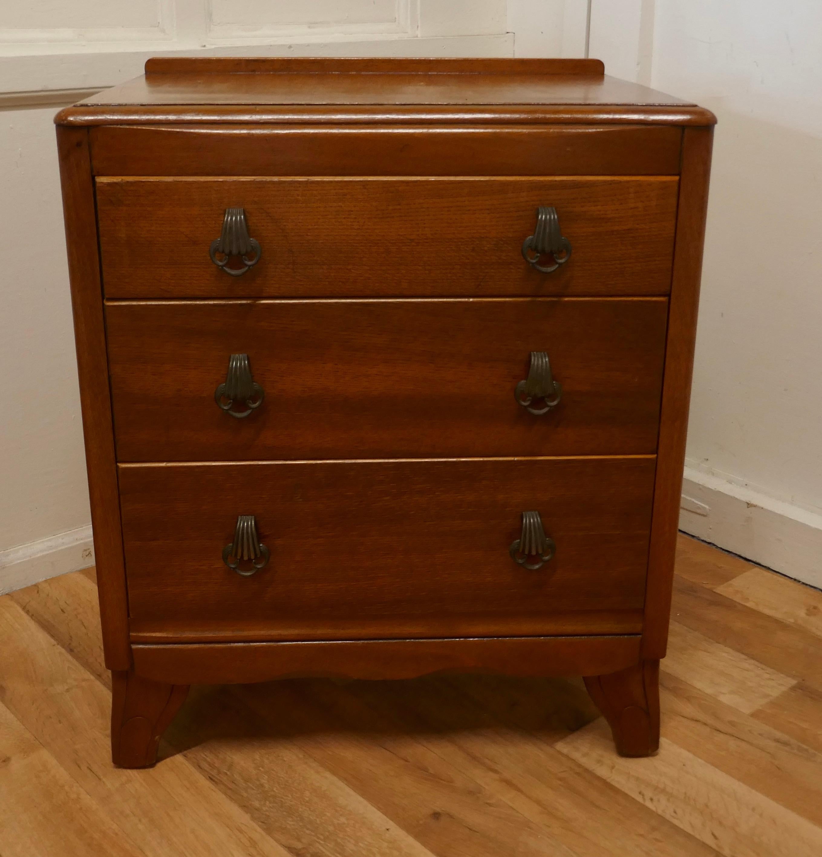 Art Deco Golden Oak Chest of Drawers by Lebus

This is a Classic piece of Oak Furniture from the 1930/40 Art Deco period, the chest has a slight curve to the top with a moulded edge 
The 3 long drawers have sturdy decorative handles and it stands