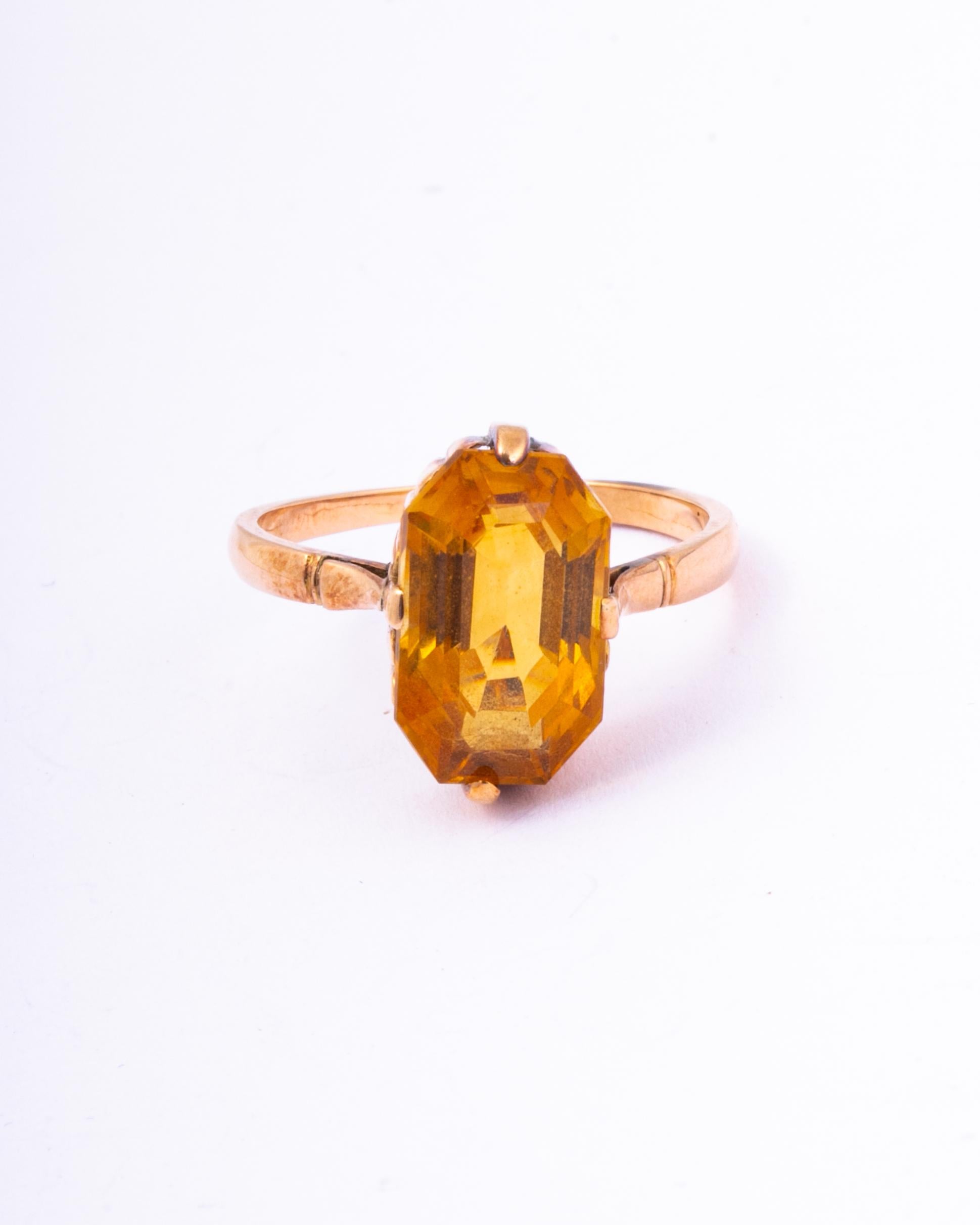 Striking oval golden topaz set in a classic art deco 9ct gold setting and band.

Ring Size: P 1/2 or 8
Stone Dimensions: 14x8mm
Height Off Finger: 6.5mm

Weight: 3.6g