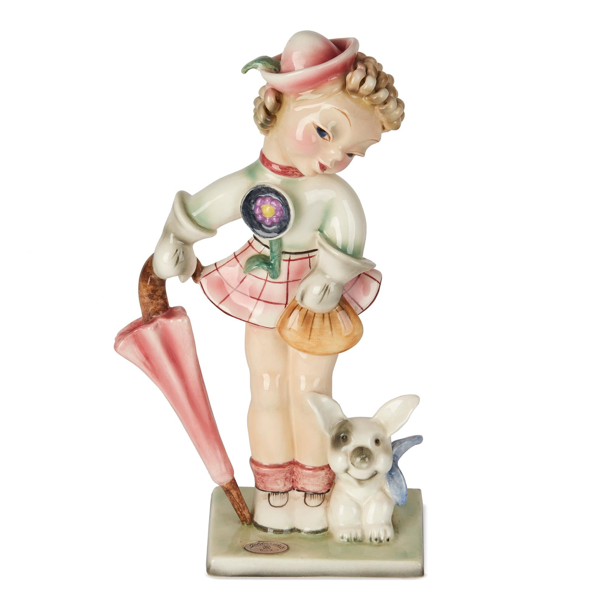 A scarce and stylish Austrian Art Deco Goldscheider, Wien, pottery figure of a young girl with a dog dating from circa 1930. The novelty young girl figure stands on a rectangular base leaning on an umbrella in one hand and carrying a bag in the